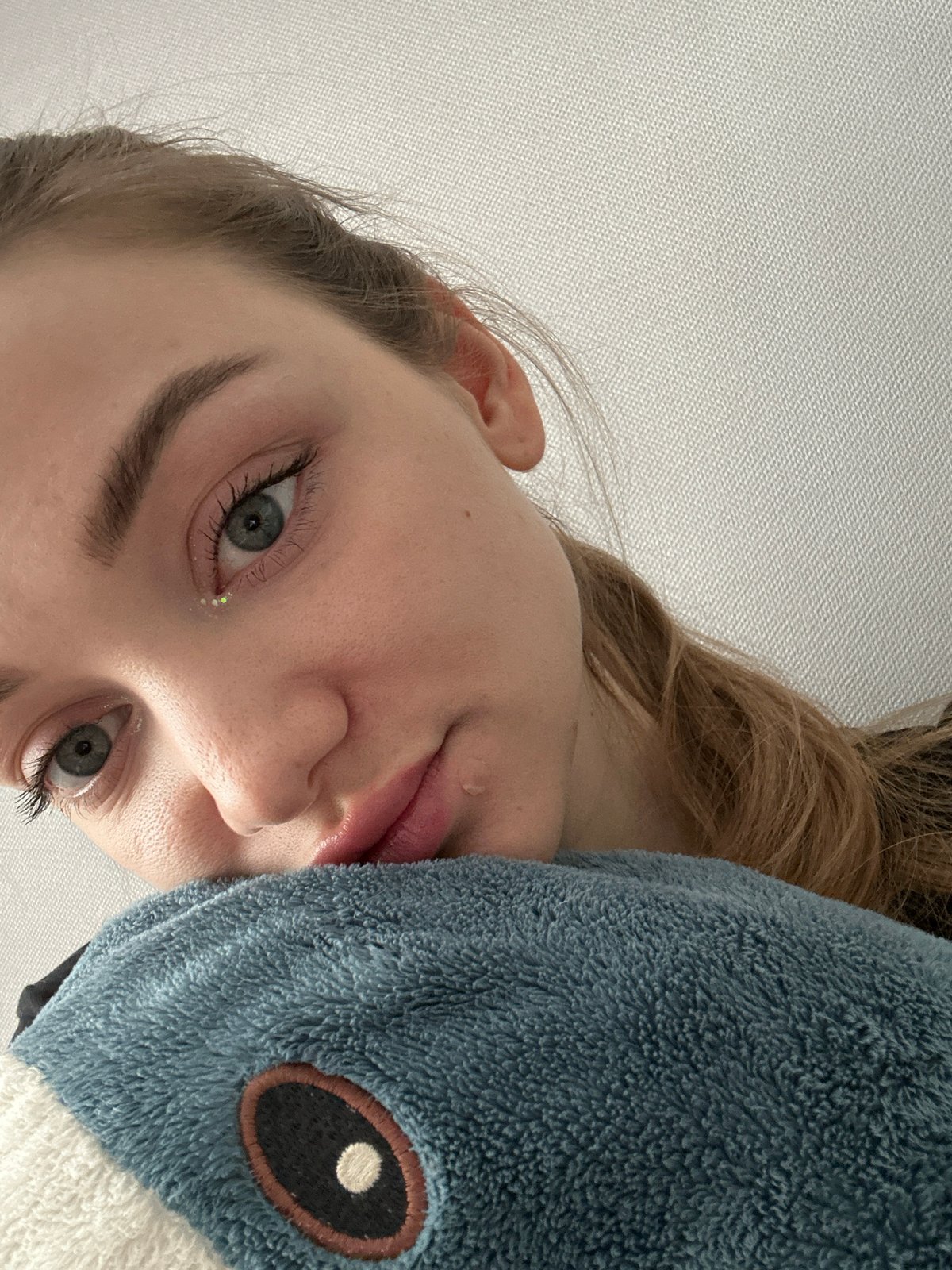 Person shares quiet morning moments with ginger cat in Kazan