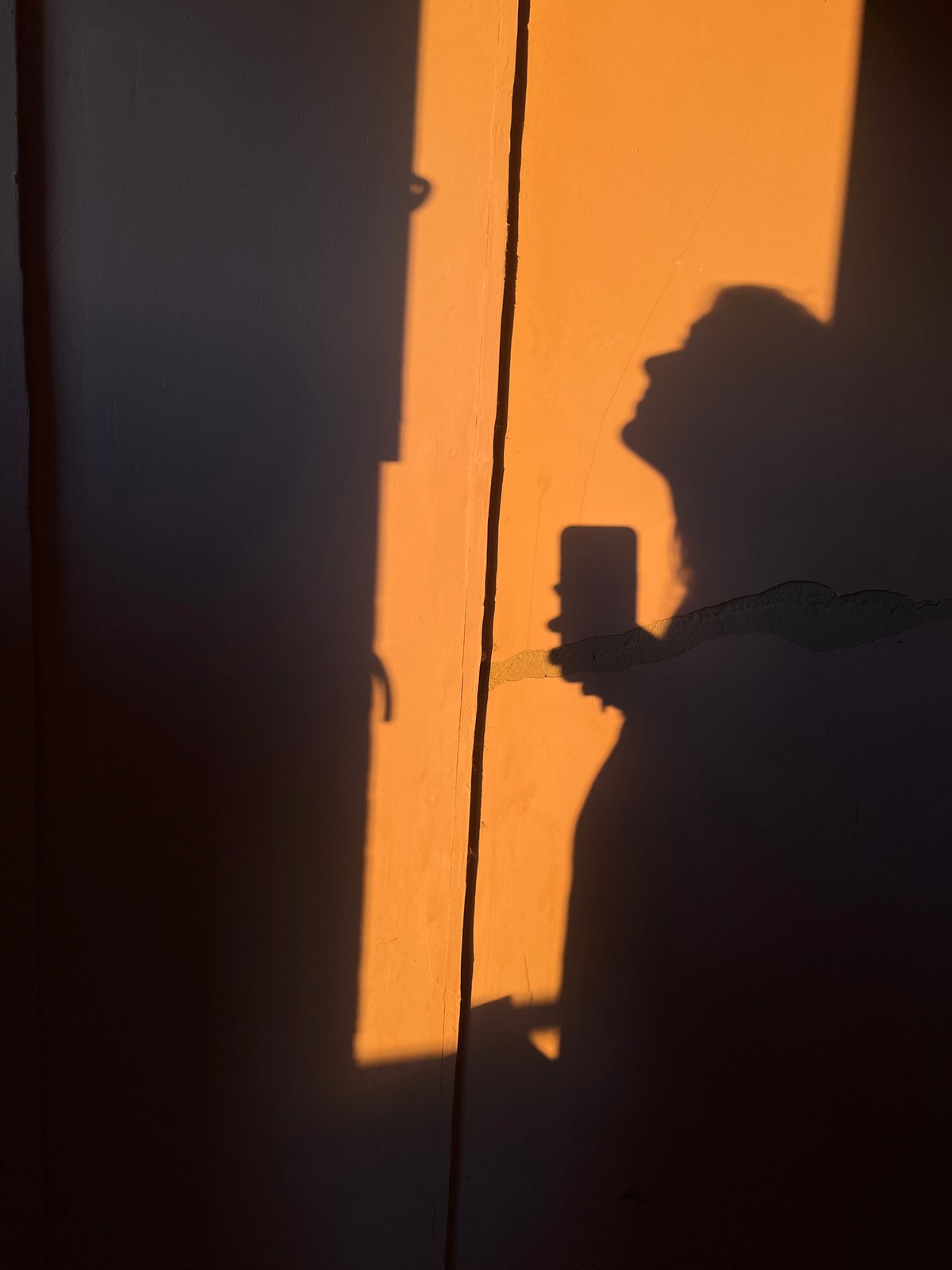 Sunset and shadows through Kyiv's unfinished walls