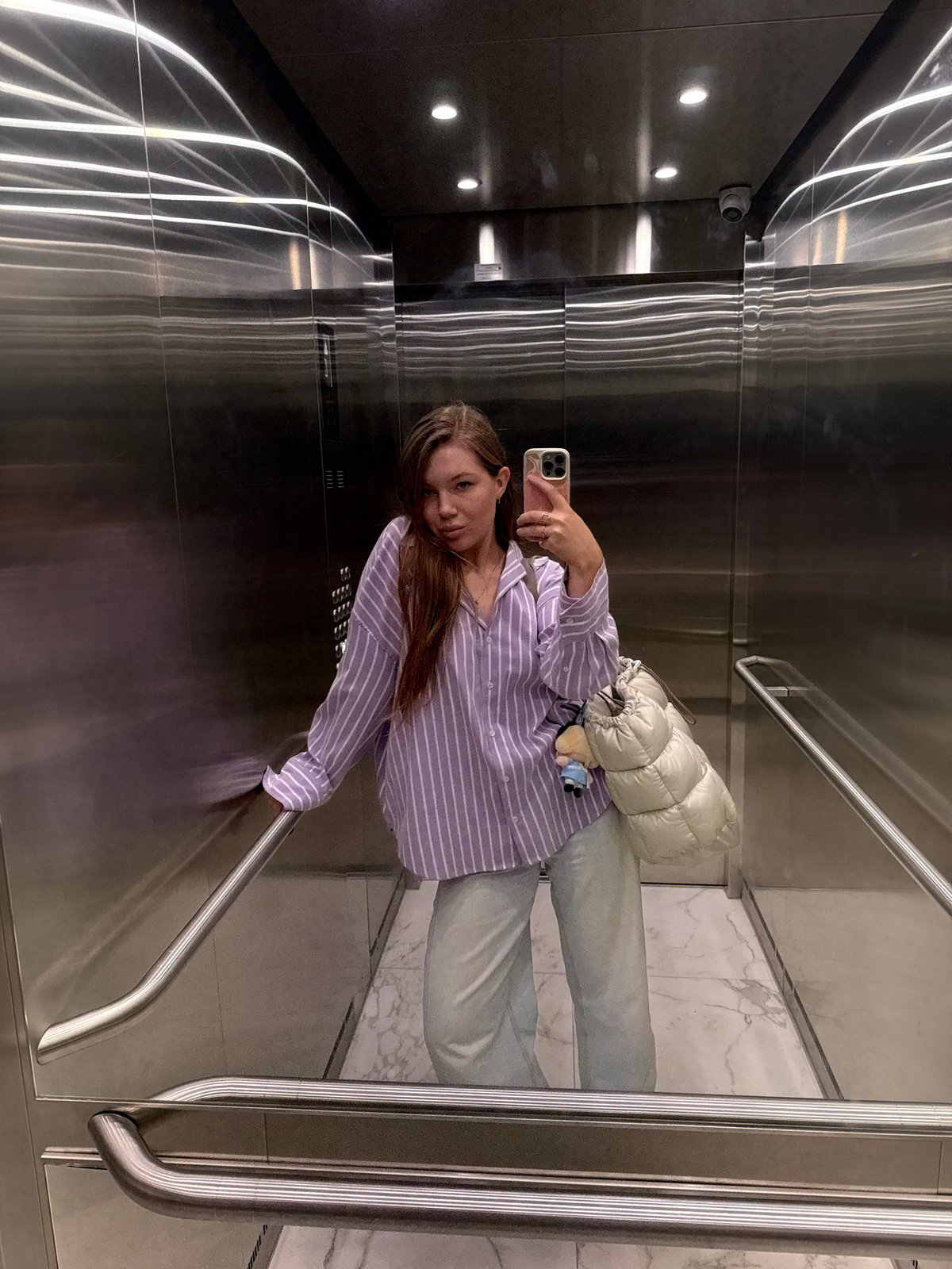 Woman takes elevator selfie in Belgrade