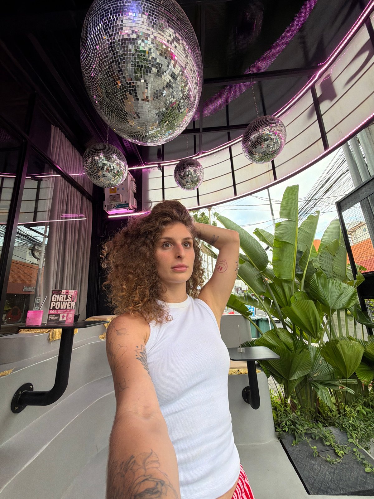 Morning hangout at a Bali venue with disco balls and selfies