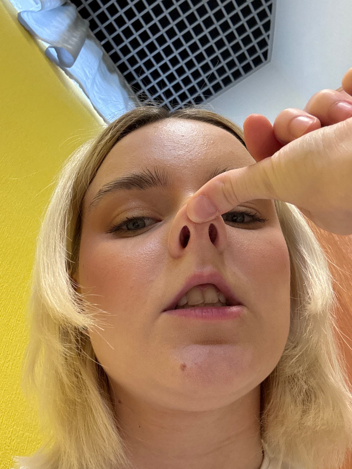 Woman enjoys casual meal, takes playful photos in Saint Petersburg