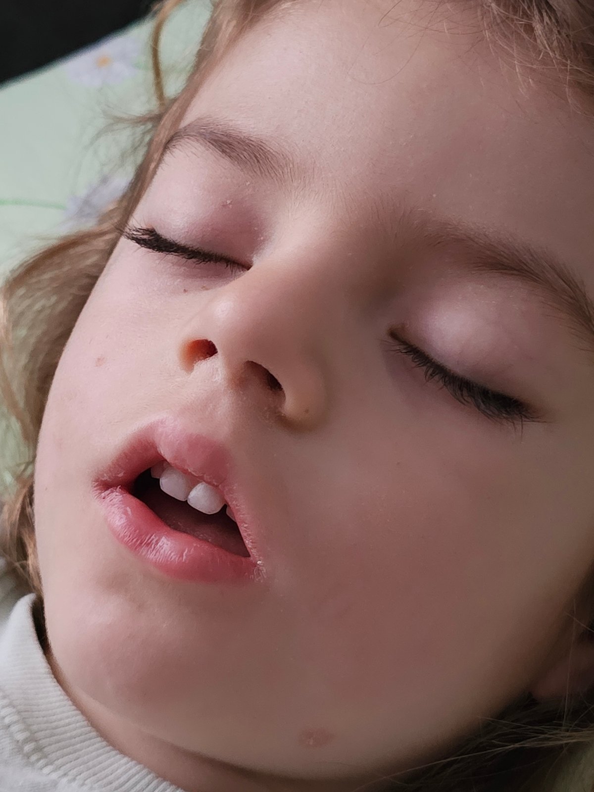 Sleeping child photographed in quiet morning moment in Khimki