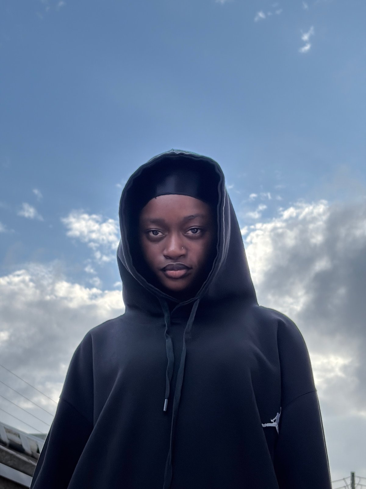 Hooded figure and open sky, Igboefon afternoon
