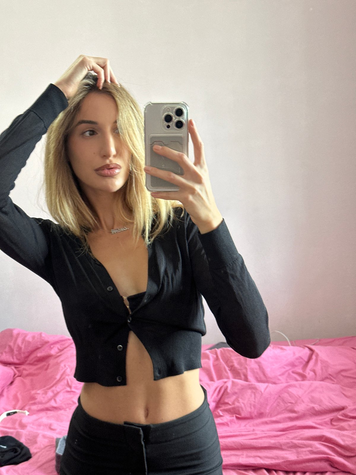 Mirror selfie session in a Moscow bedroom, mid-afternoon.