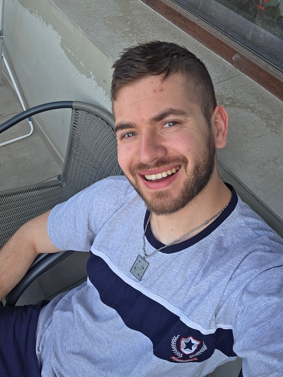 Man takes morning selfies on balcony in Bulgarian village