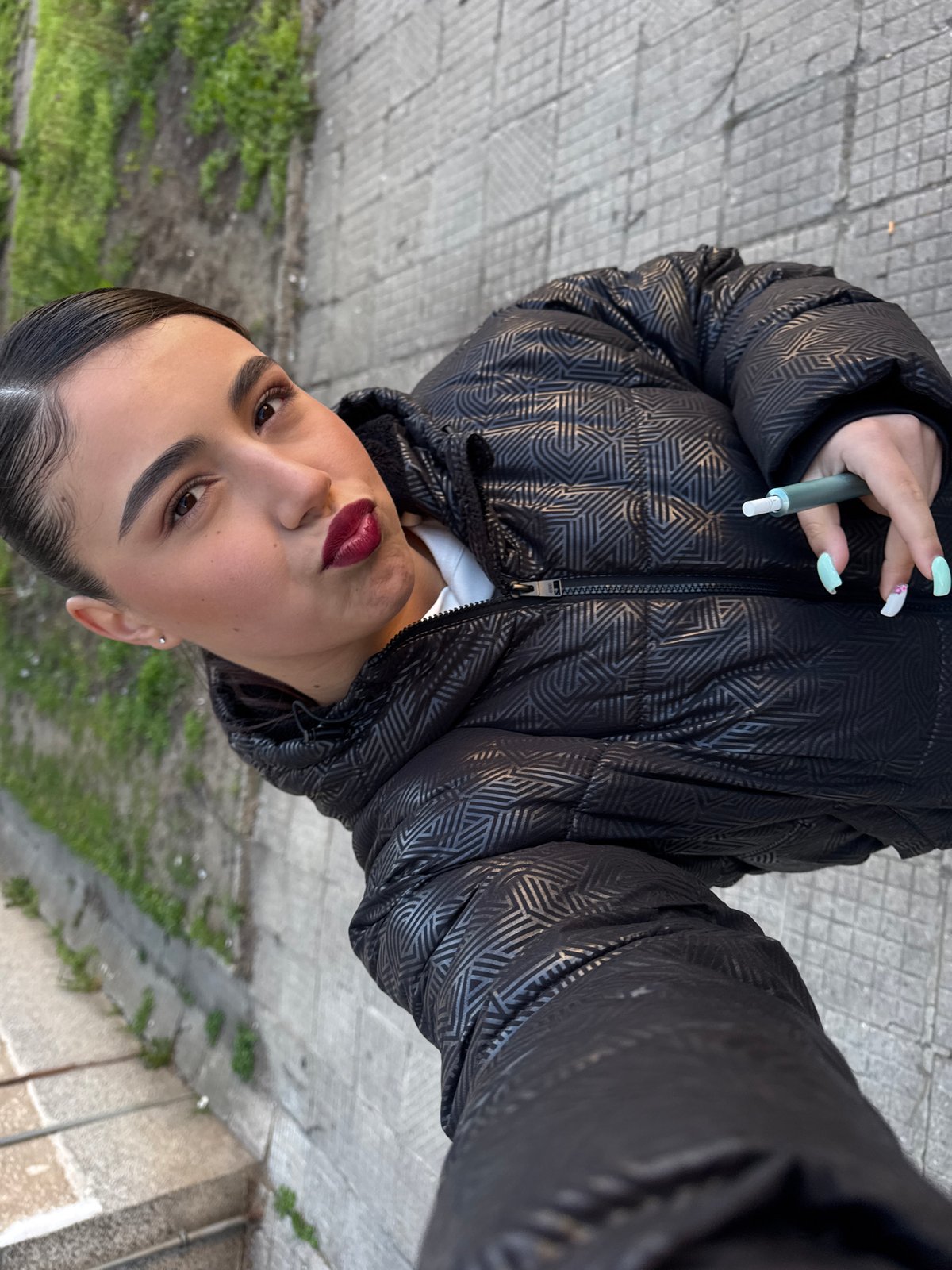 Woman with e-cigarette spotted in Sofia wearing puffer jacket