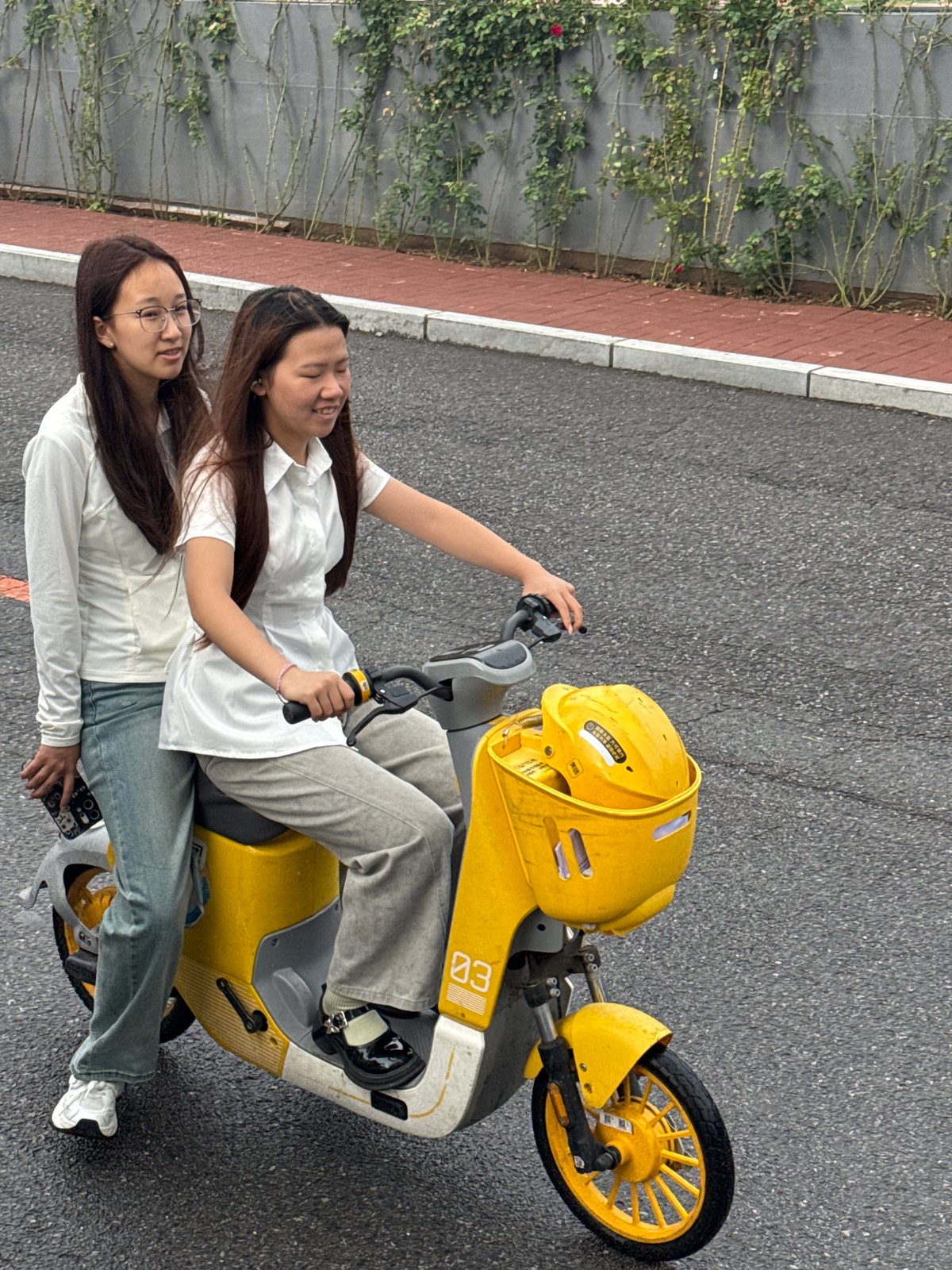 Morning movement through Zhongtun streets on scooters and foot