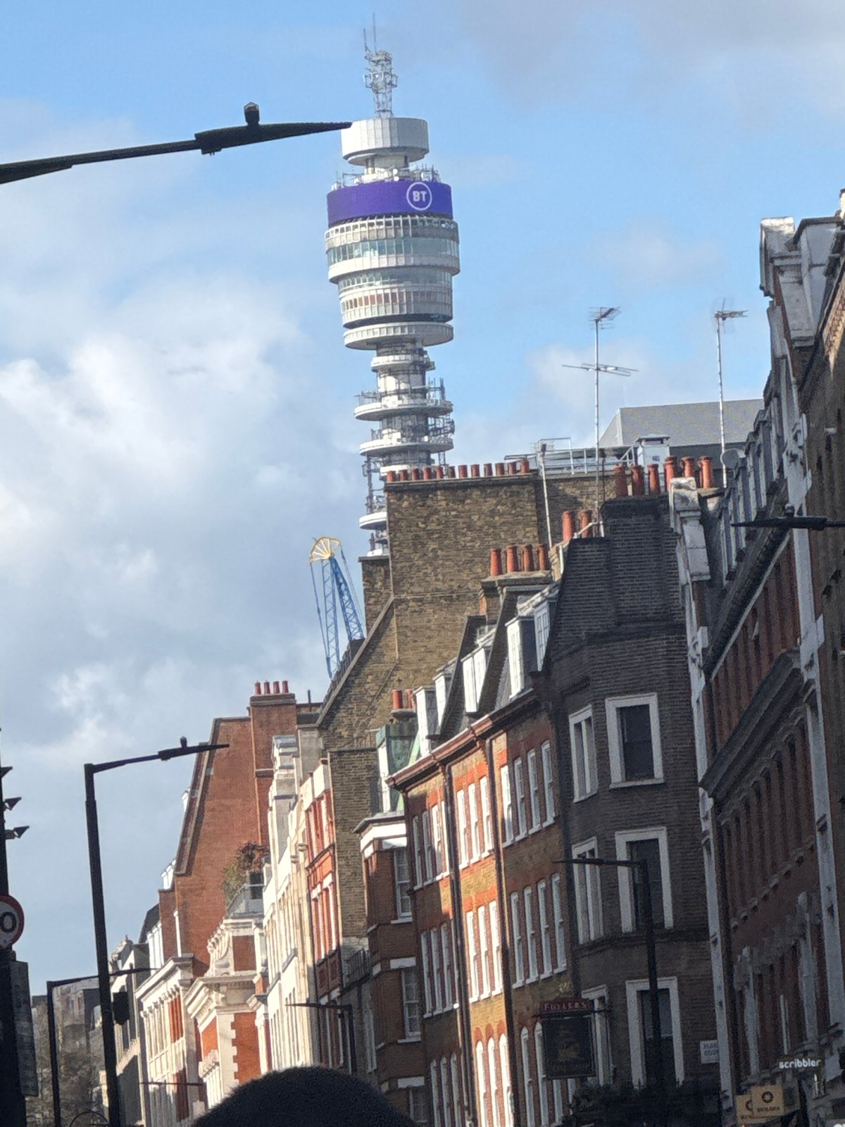Tourist explores London landmarks and themed attractions in afternoon stroll