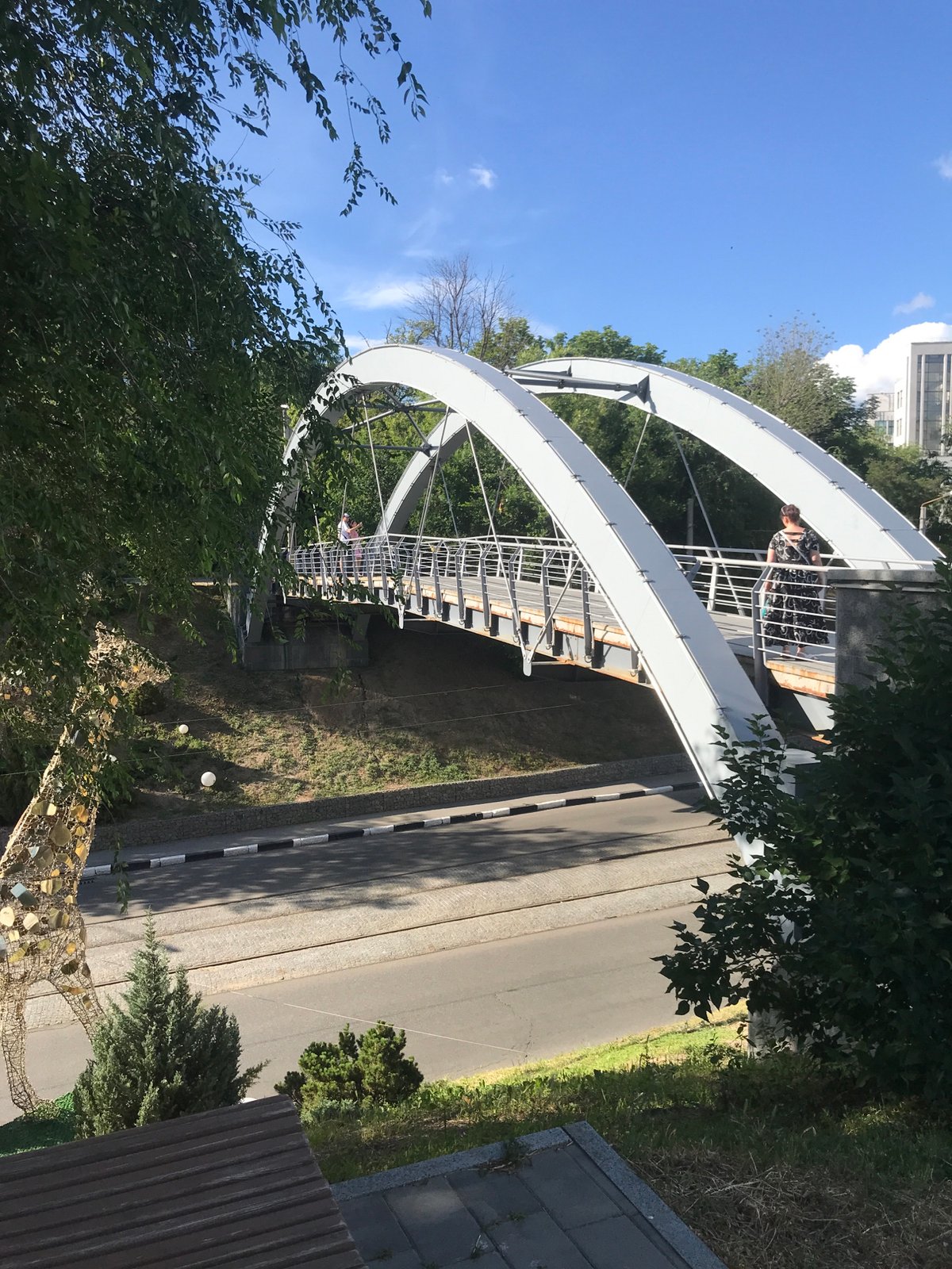 Urban afternoon scenes featuring bridge, fountain, and polar bear statue