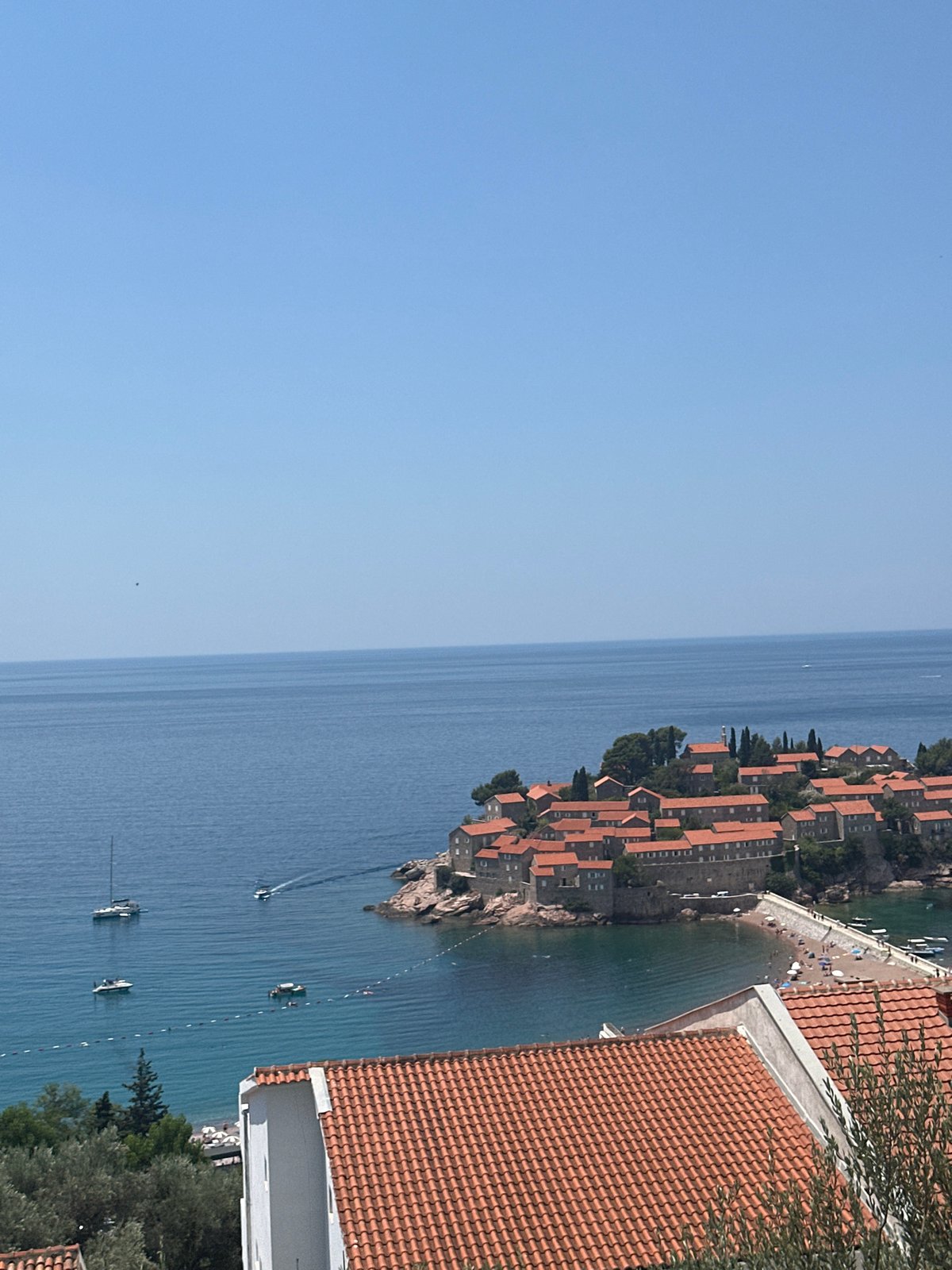 Sveti Stefan's fortified island and coastline from multiple viewpoints
