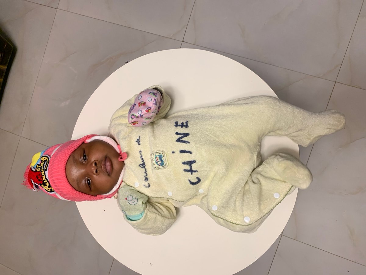 Infant in colorful winter clothing observed in Rafin Bauna