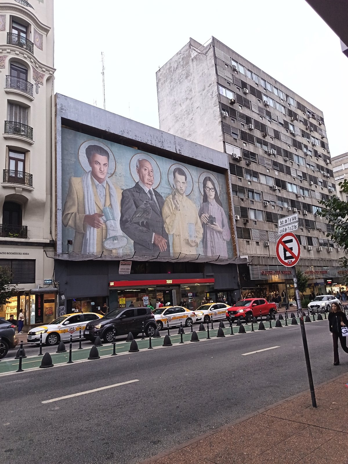 Religious mural featuring four haloed figures spotted in Montevideo