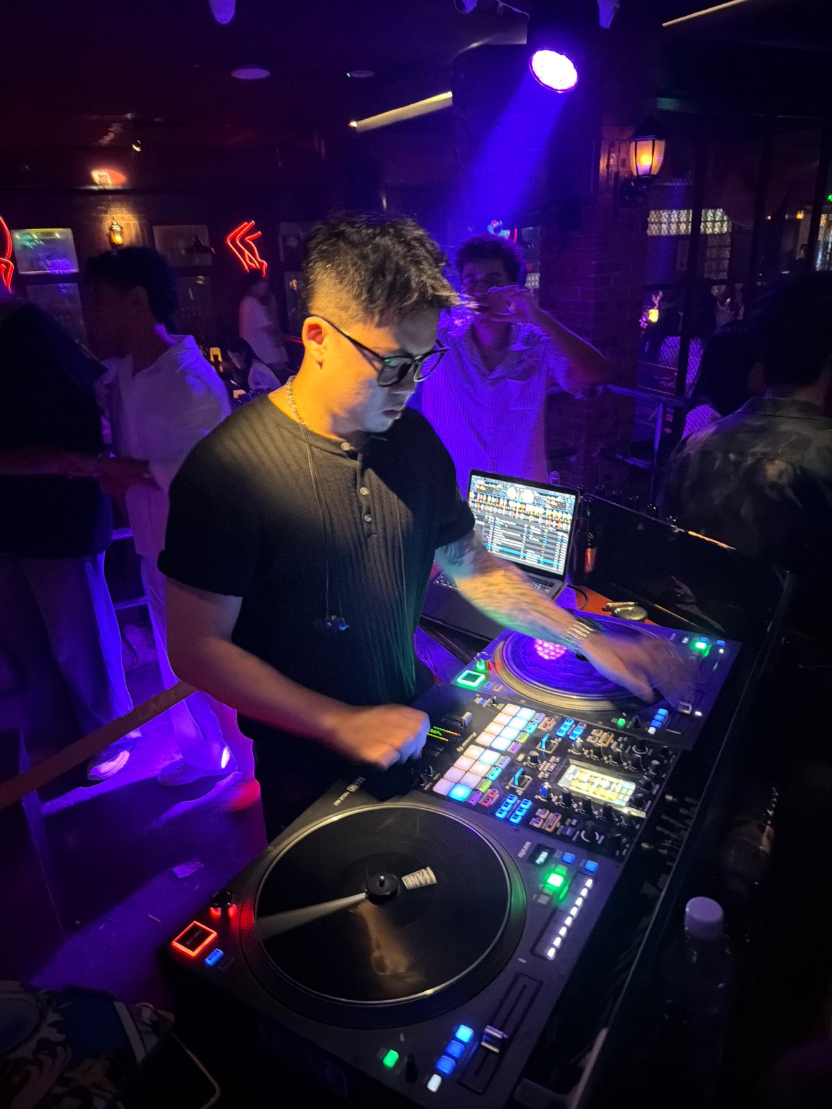 Live DJ set at a Liangjiang club, full setup running.