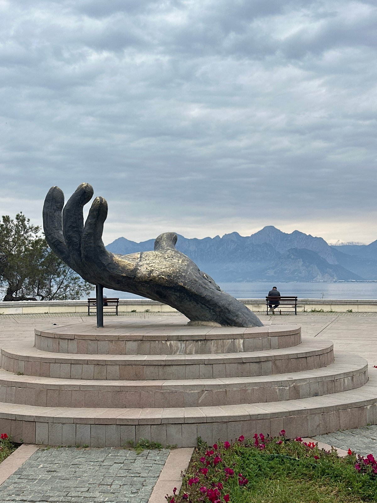 Morning scenes captured in Antalya: sculpture, cat, coastline