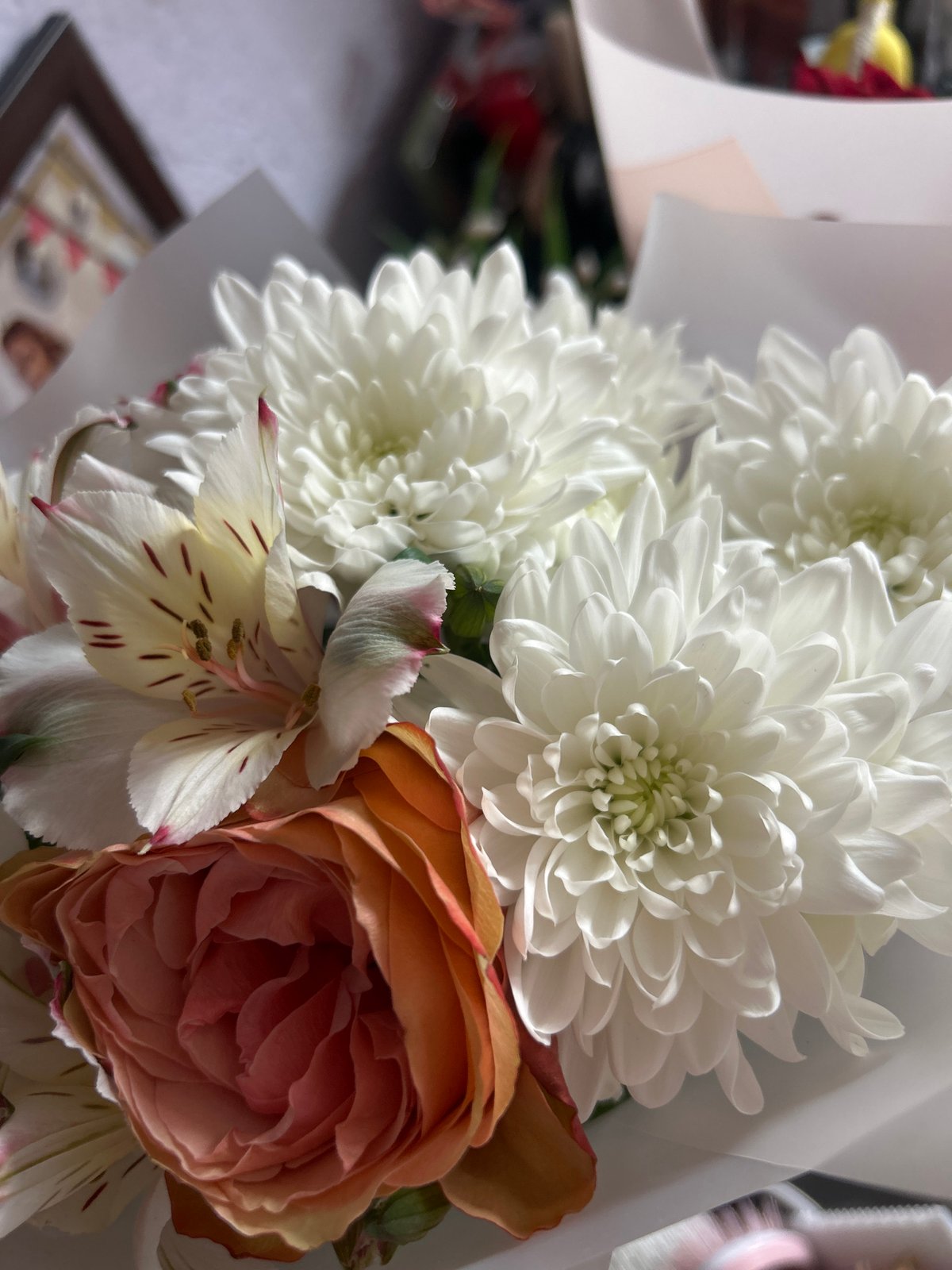 Quiet domestic moments: flowers, Easter basket, stuffed bear companion