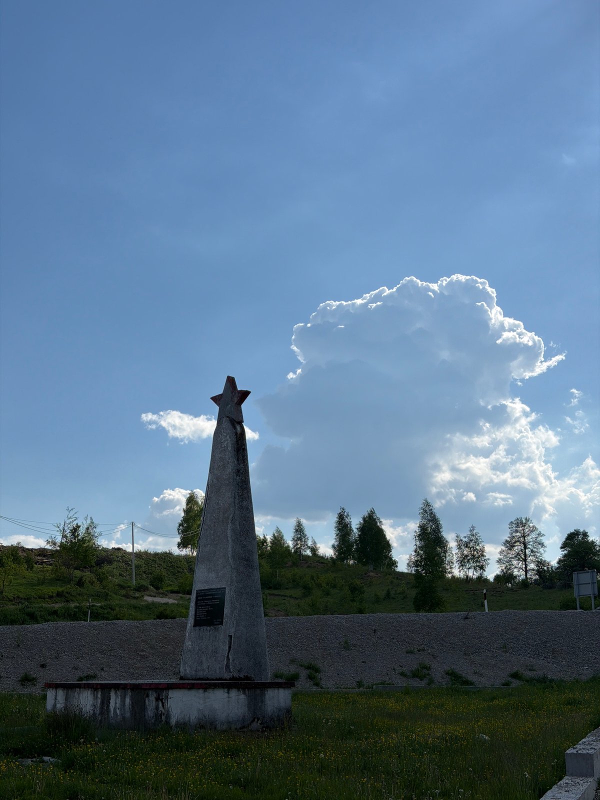 Star-topped triangular monument photographed in Marina Šuma, Montenegro