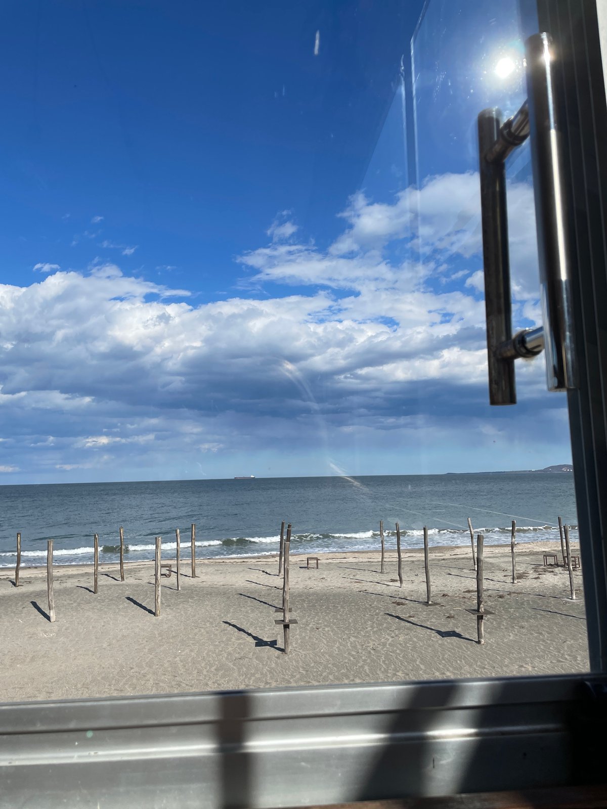 Beach view observed through window in Burgas, Bulgaria