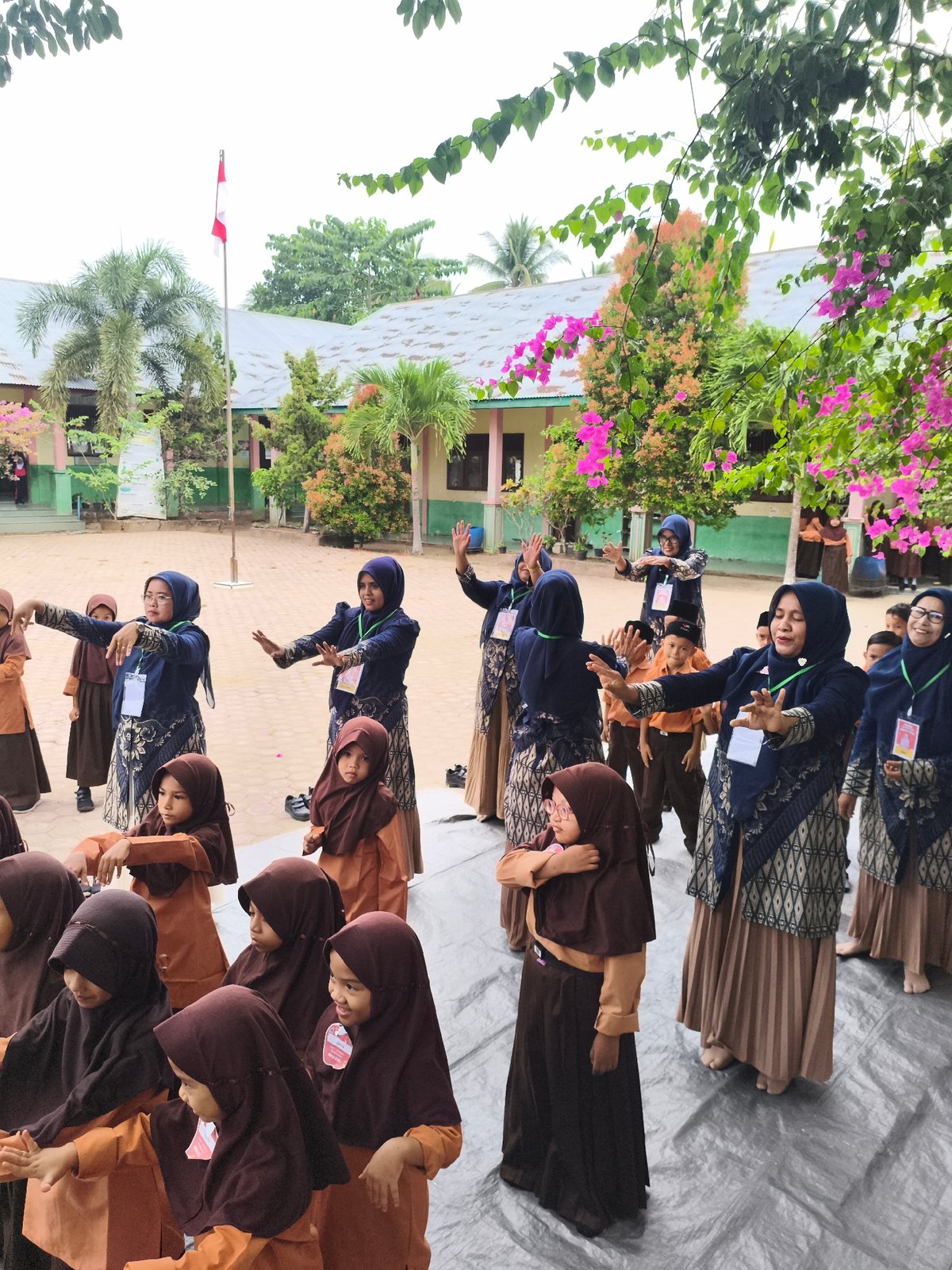 Students in uniform gathered for outdoor school event in Indonesia