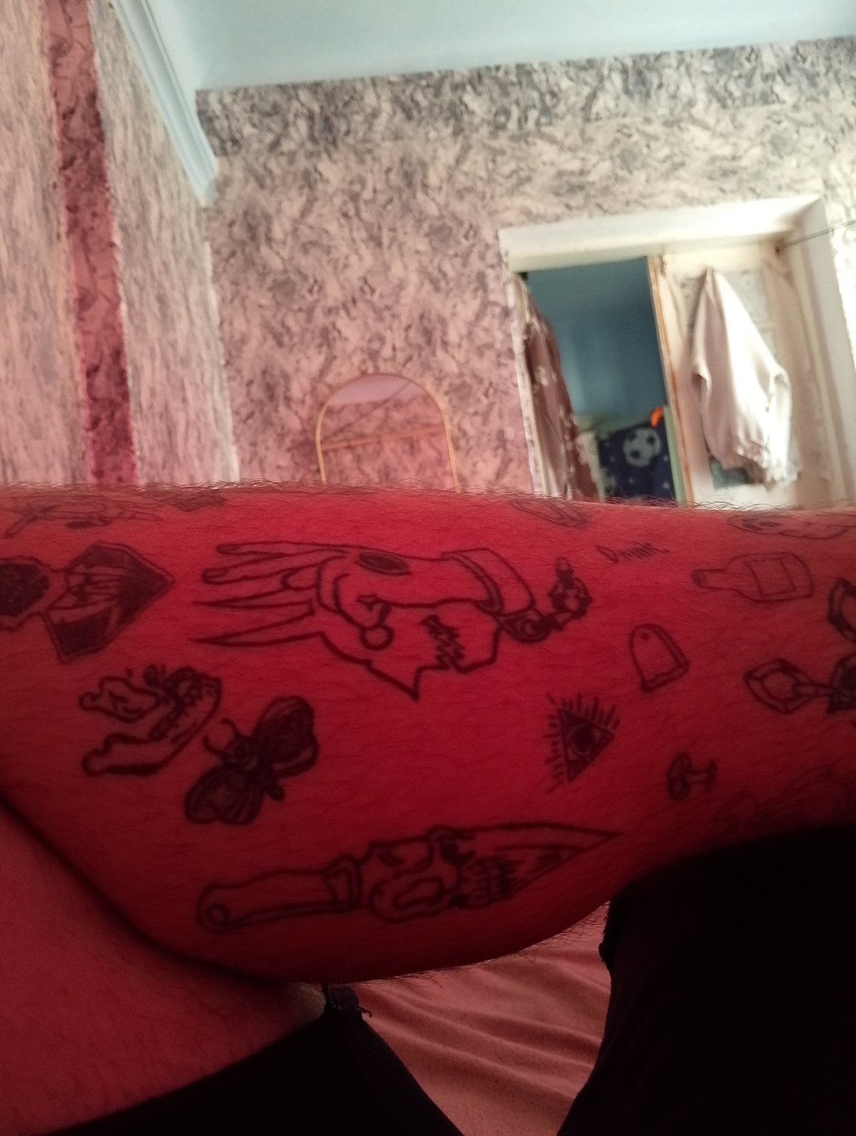 Tattooed man documents bedroom selfie session in Moldova village