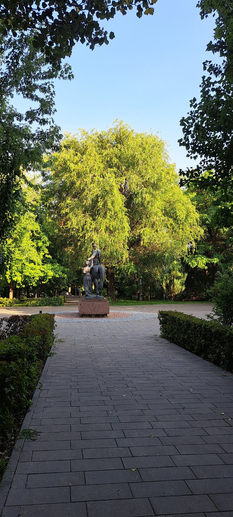 Strolling through a city park with a bronze equestrian statue