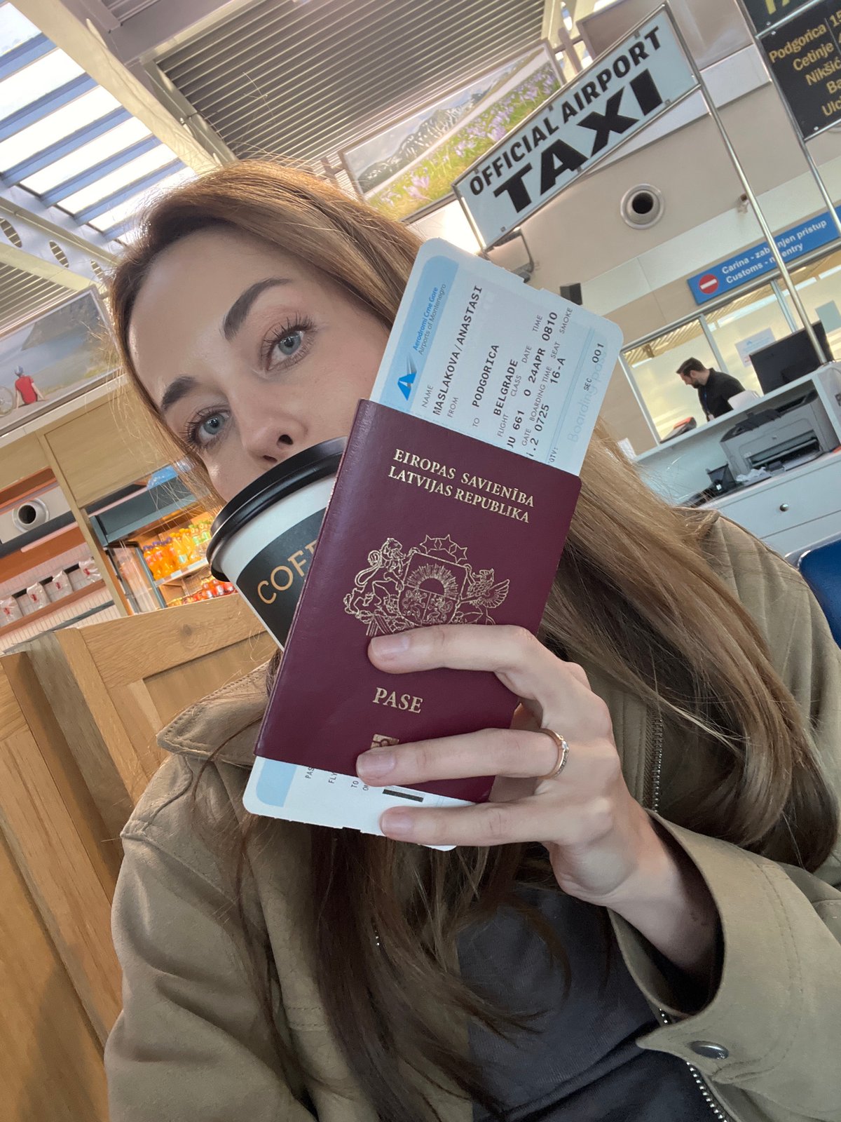 Latvian passenger prepares for Podgorica-Belgrade flight with coffee