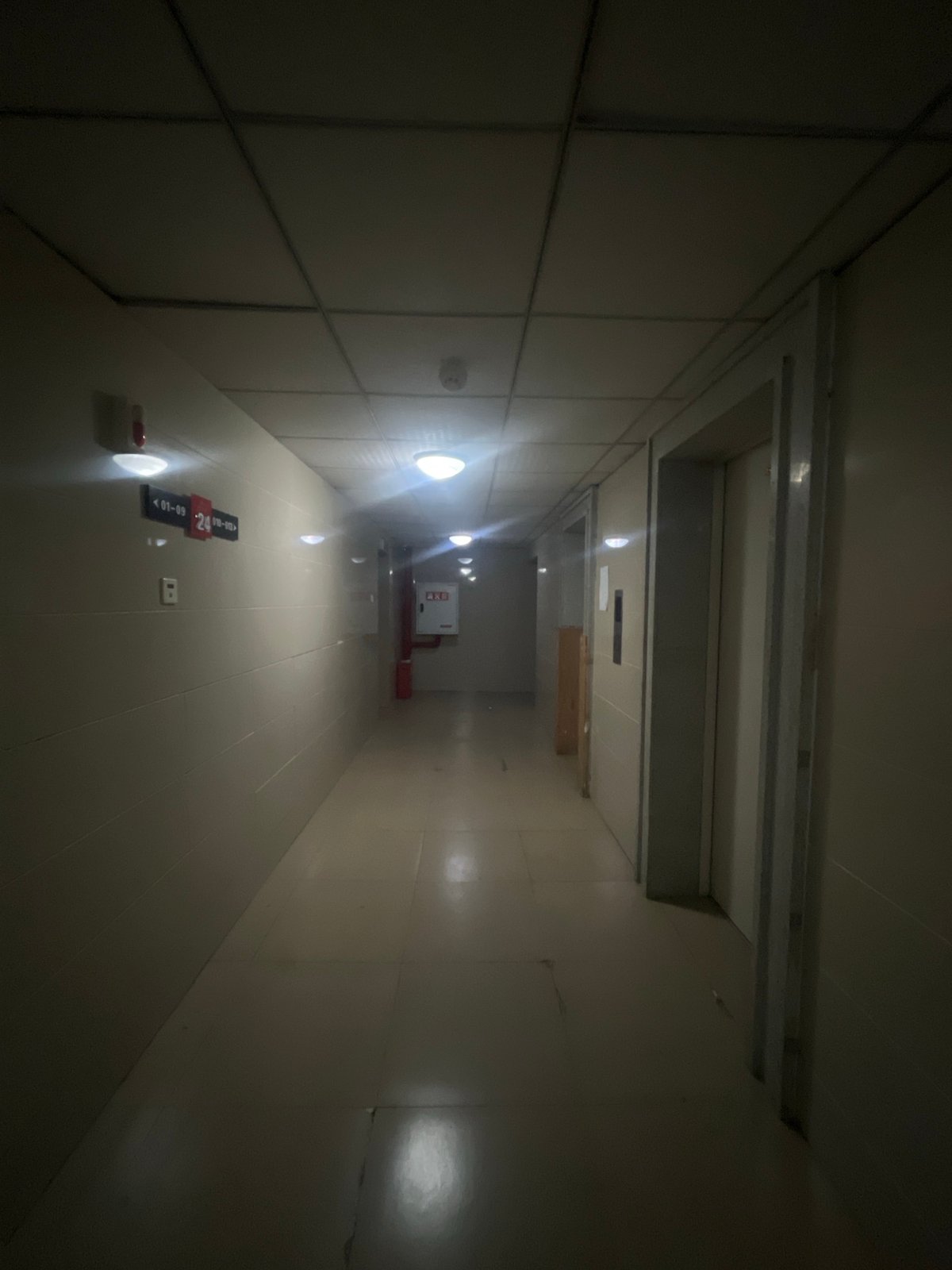 Nighttime building-to-street journey documented in Jiulongpo District
