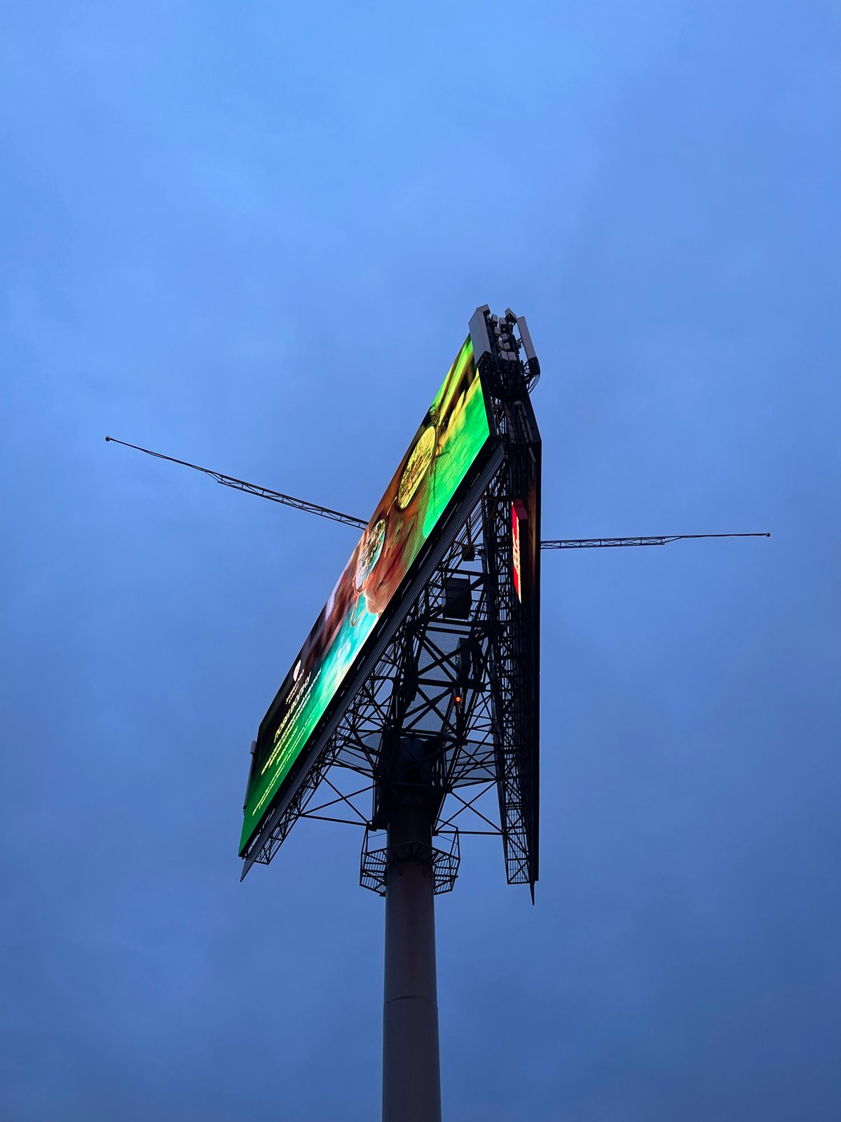 Urban scenes captured: resort billboard, waterfront night, fallen scooter