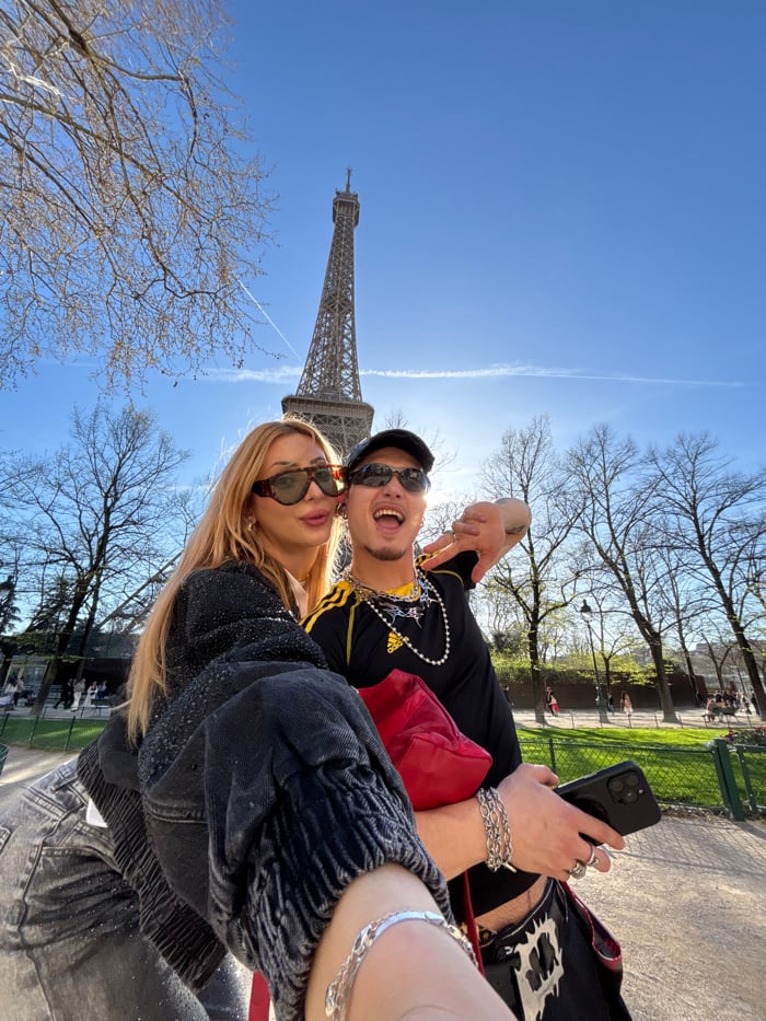 Tourist activities documented around Eiffel Tower during afternoon hours