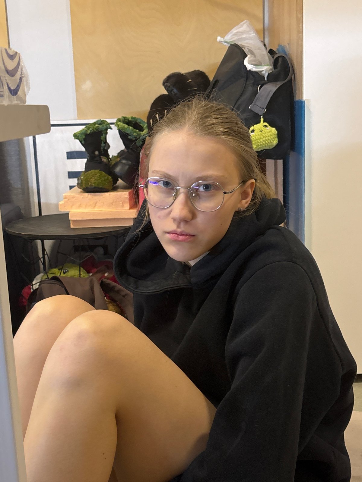 Person takes mirror selfies while eating in Perm building