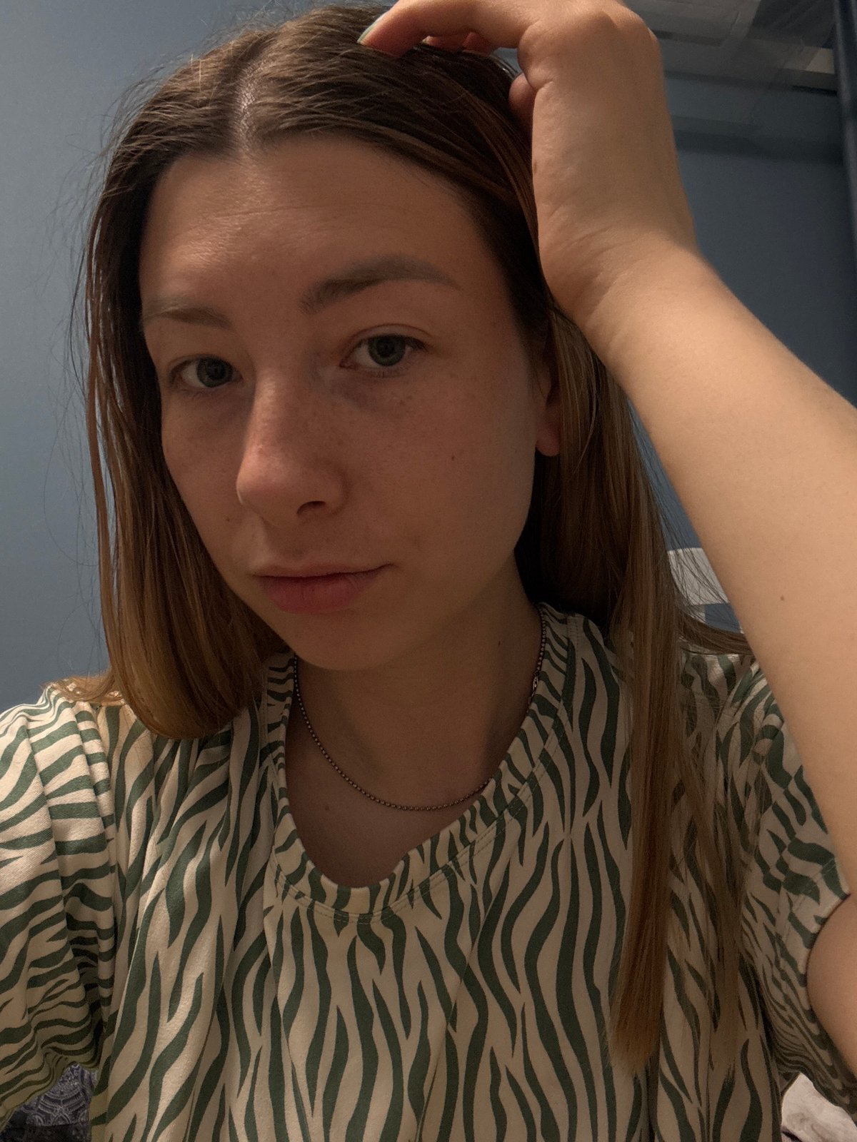 Woman poses for photos in zebra-striped top, Moscow