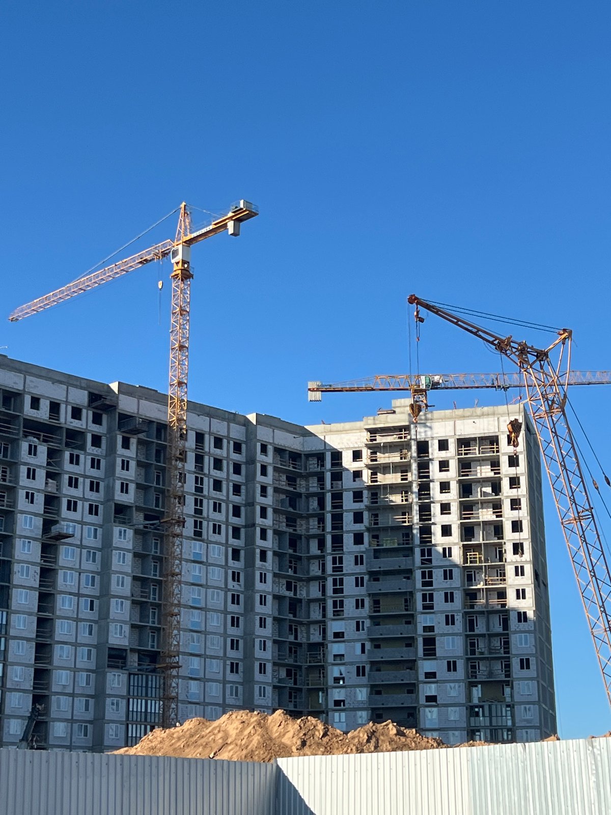Active construction zone and street-level commercial scene in Minsk