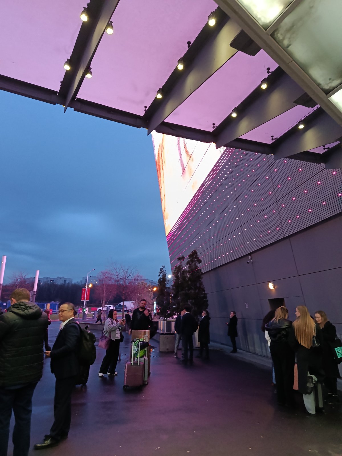 Evening gathering outside modern building in Khimki, Russia