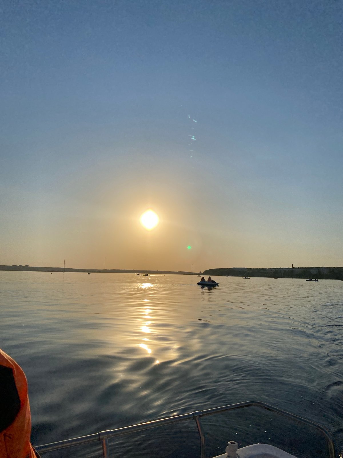 Sunset boating activities documented on Izhevsk Pond, Russia
