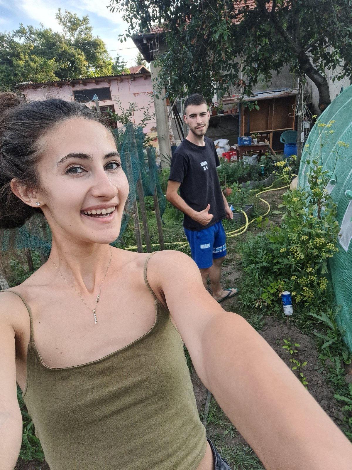 Quick tour of a small farm: chickens, tomatoes, and weathered statues