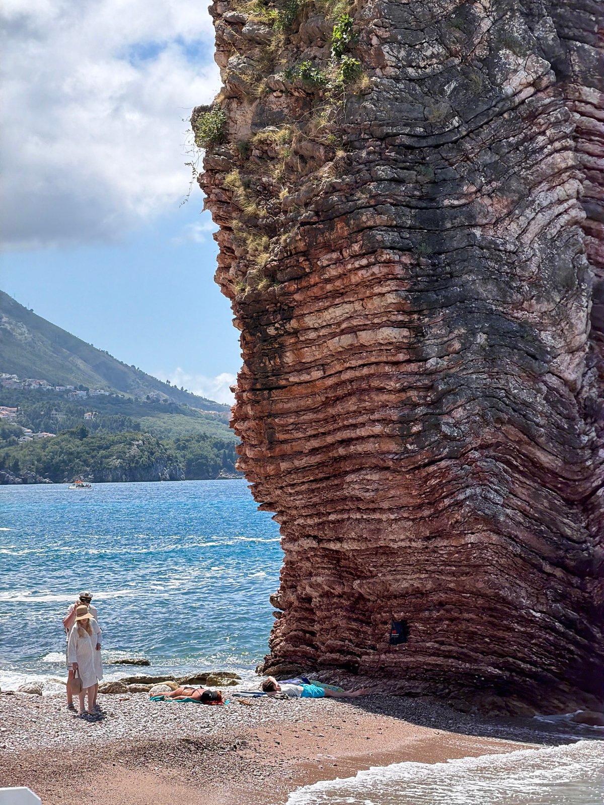 Tourist documents scenic coastal visit to Boreti, Montenegro beaches