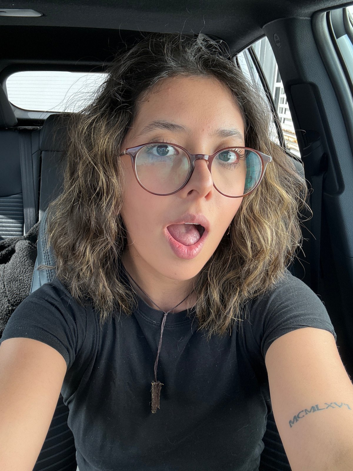Person Takes Selfies in Car in Puebla, Mexico