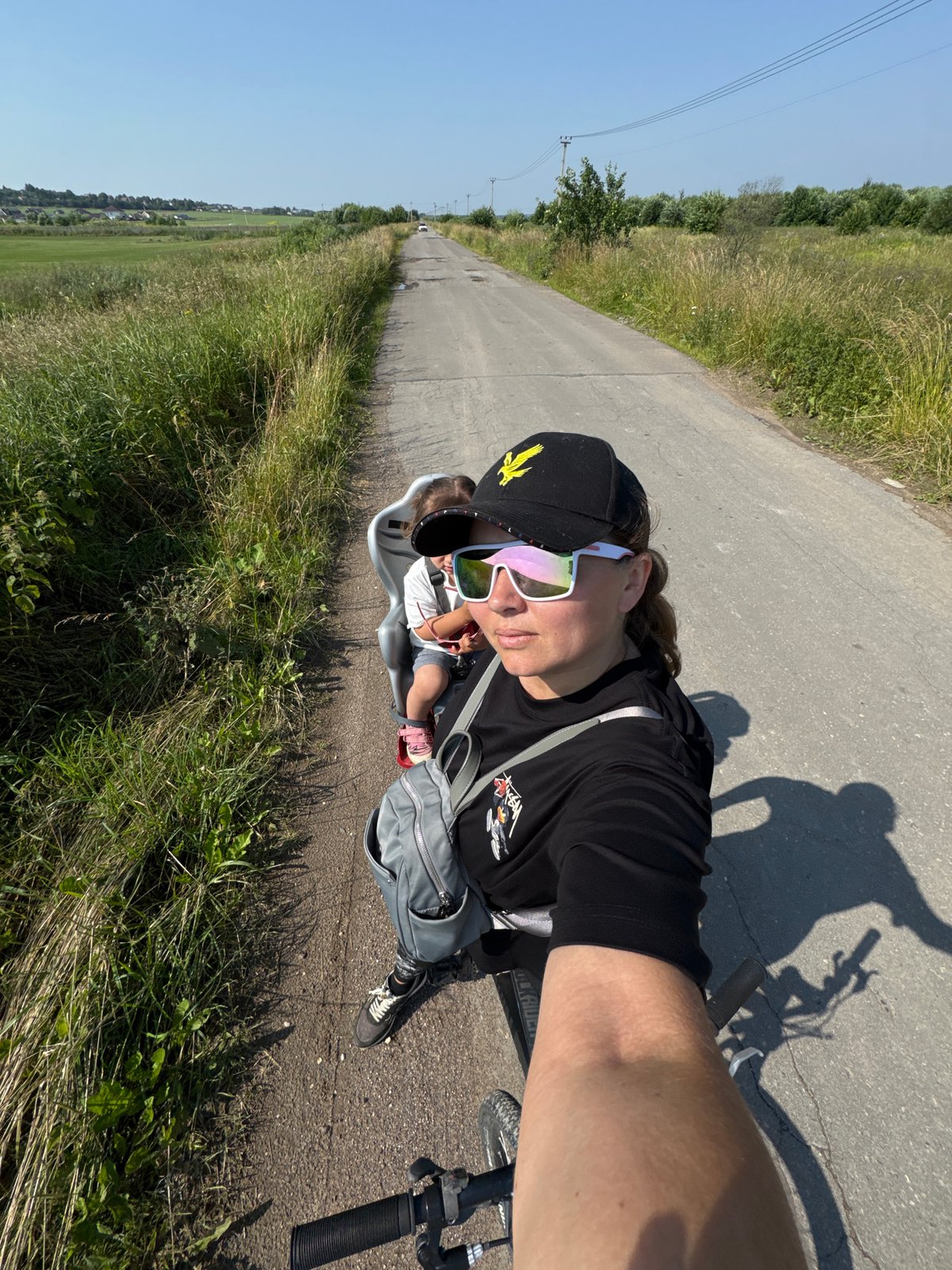 Morning bike ride in Kempelevo with a tiny sunglass-wearing passenger