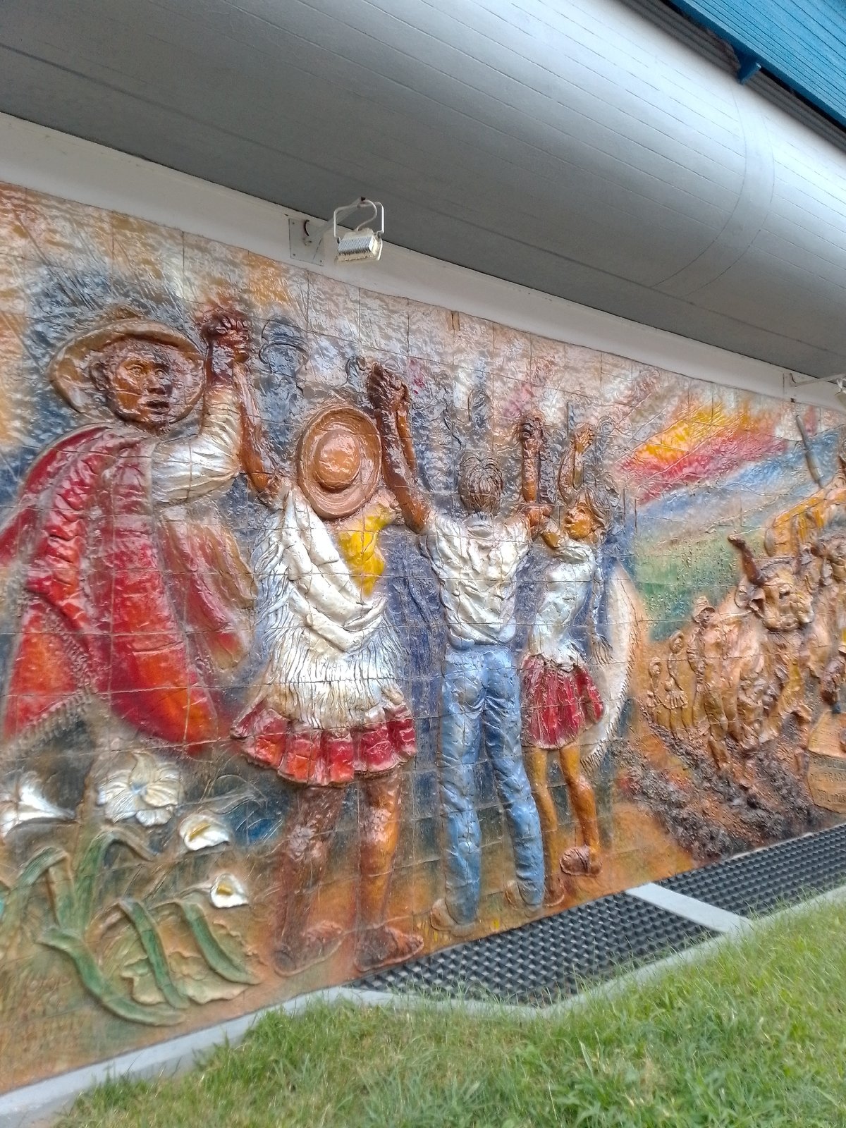 Tarija street scenes captured: mural, monument, sweater-wearing dog