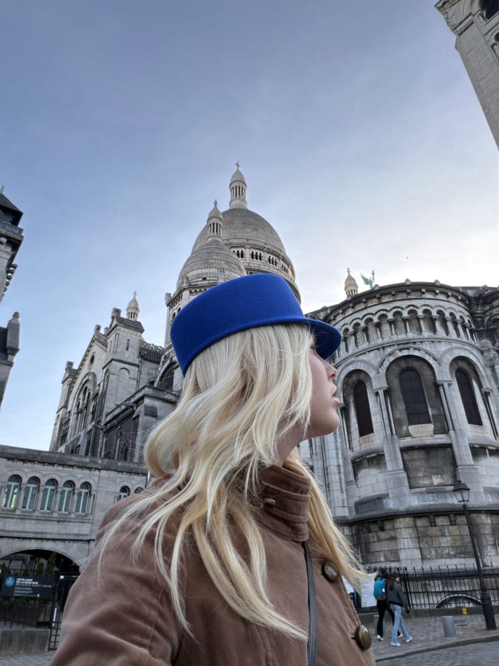 Tourist visits Sacré-Cœur Basilica in Paris afternoon