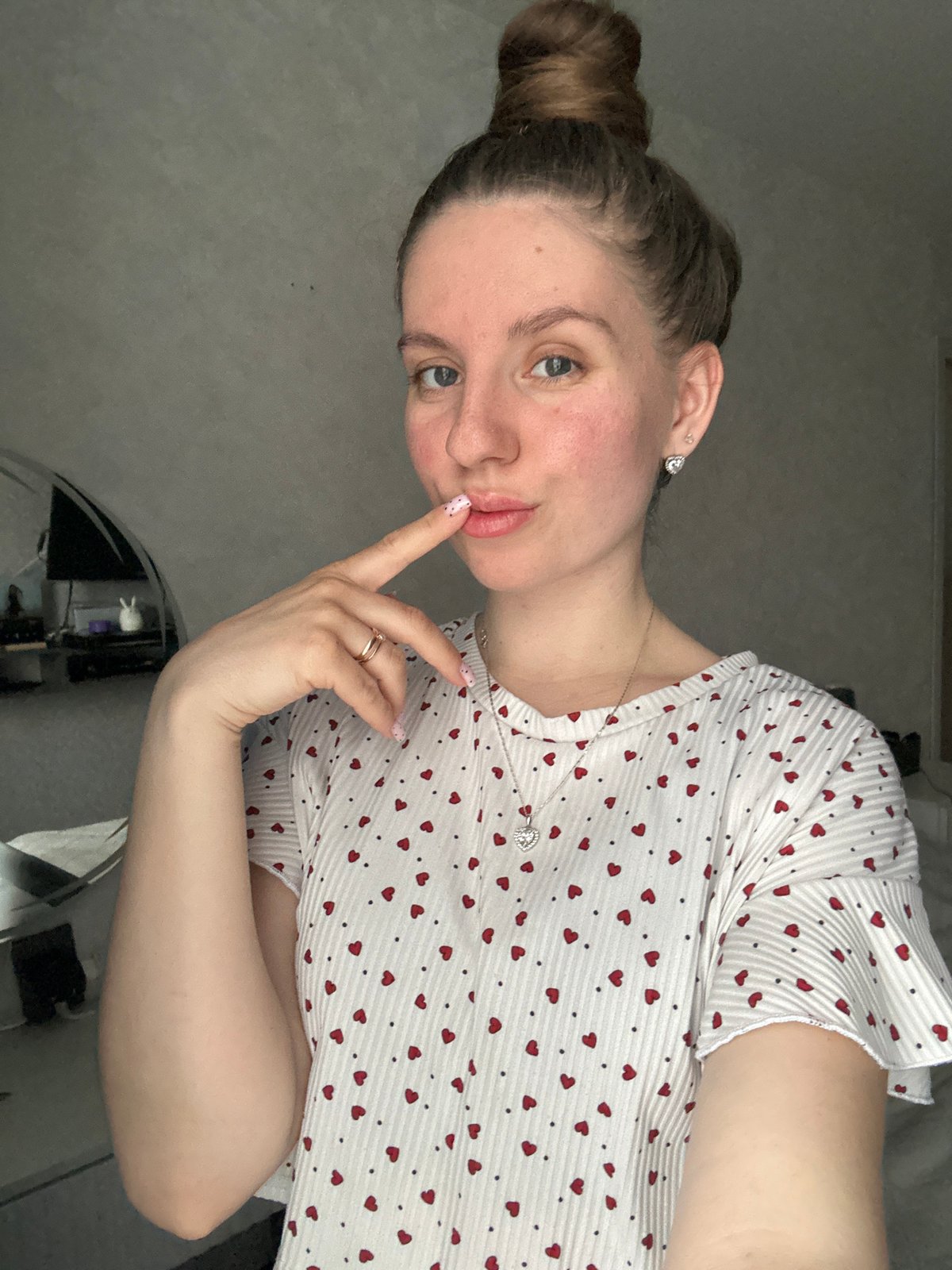 Woman documents skincare routine with electronic devices in Klin