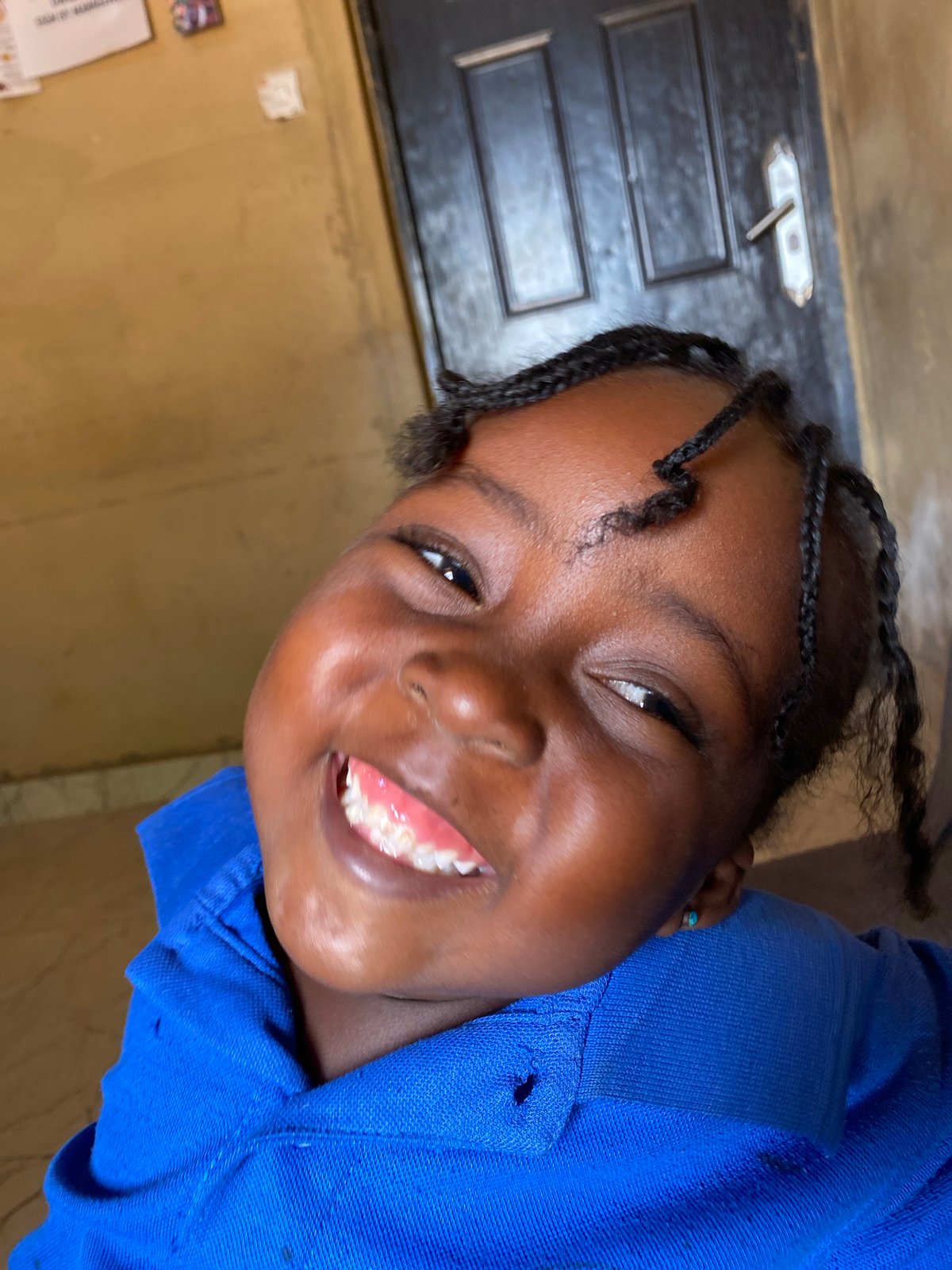 Young girl poses for cheerful portraits in Kuru Dungus