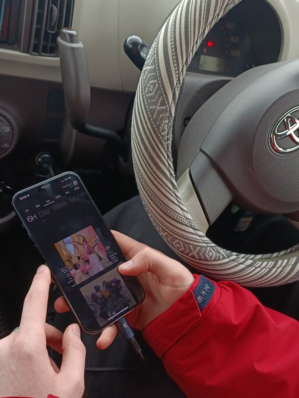Driver checks social media while charging phone in Krasnoyarsk