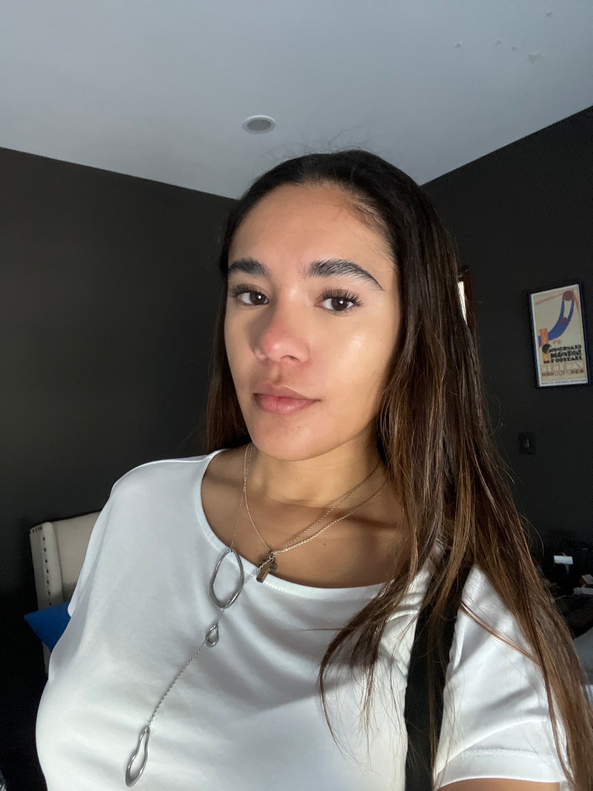Woman takes indoor selfies in San Bernardino Tlaxcalancingo, Mexico