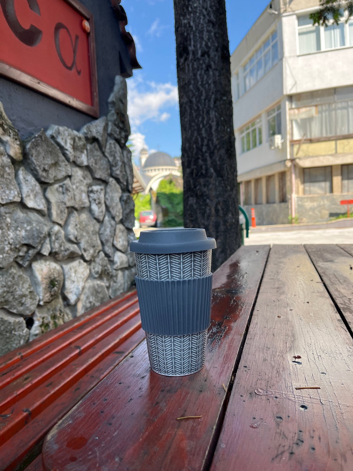 Coffee cup spotted on picnic table in Smolyan