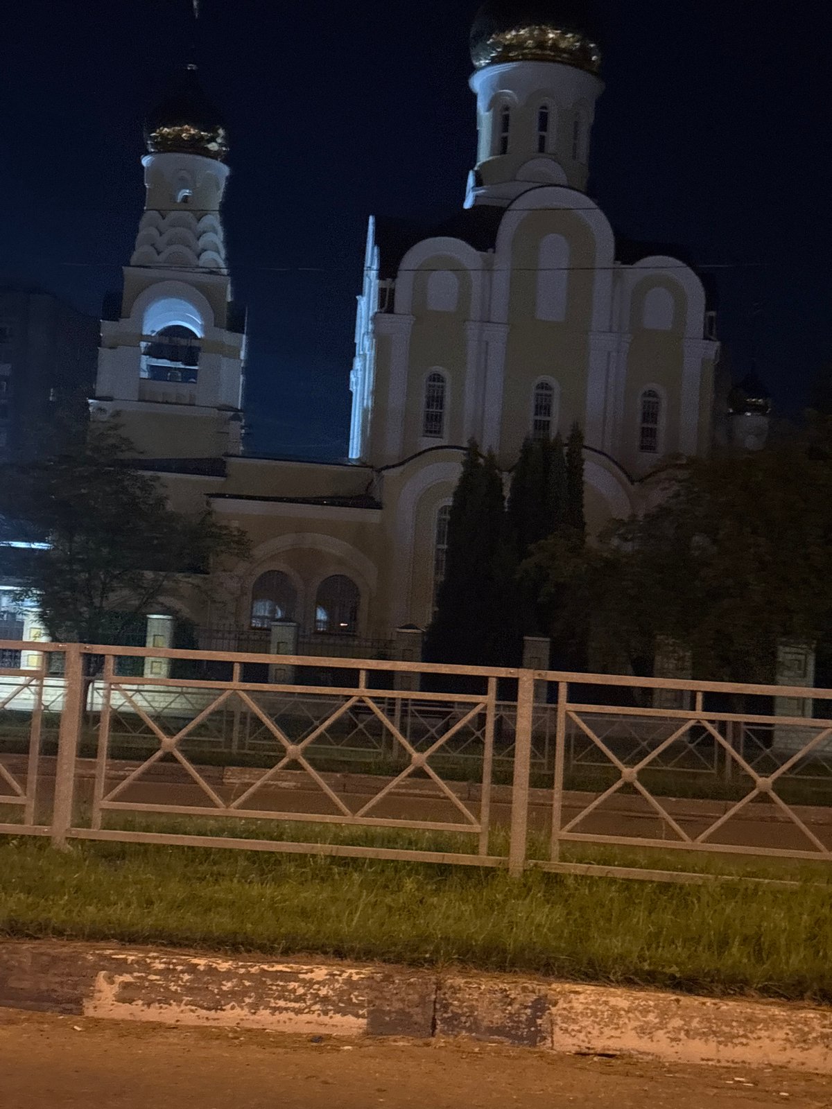 Holy Trinity Cathedral lit up at night in Obninsk