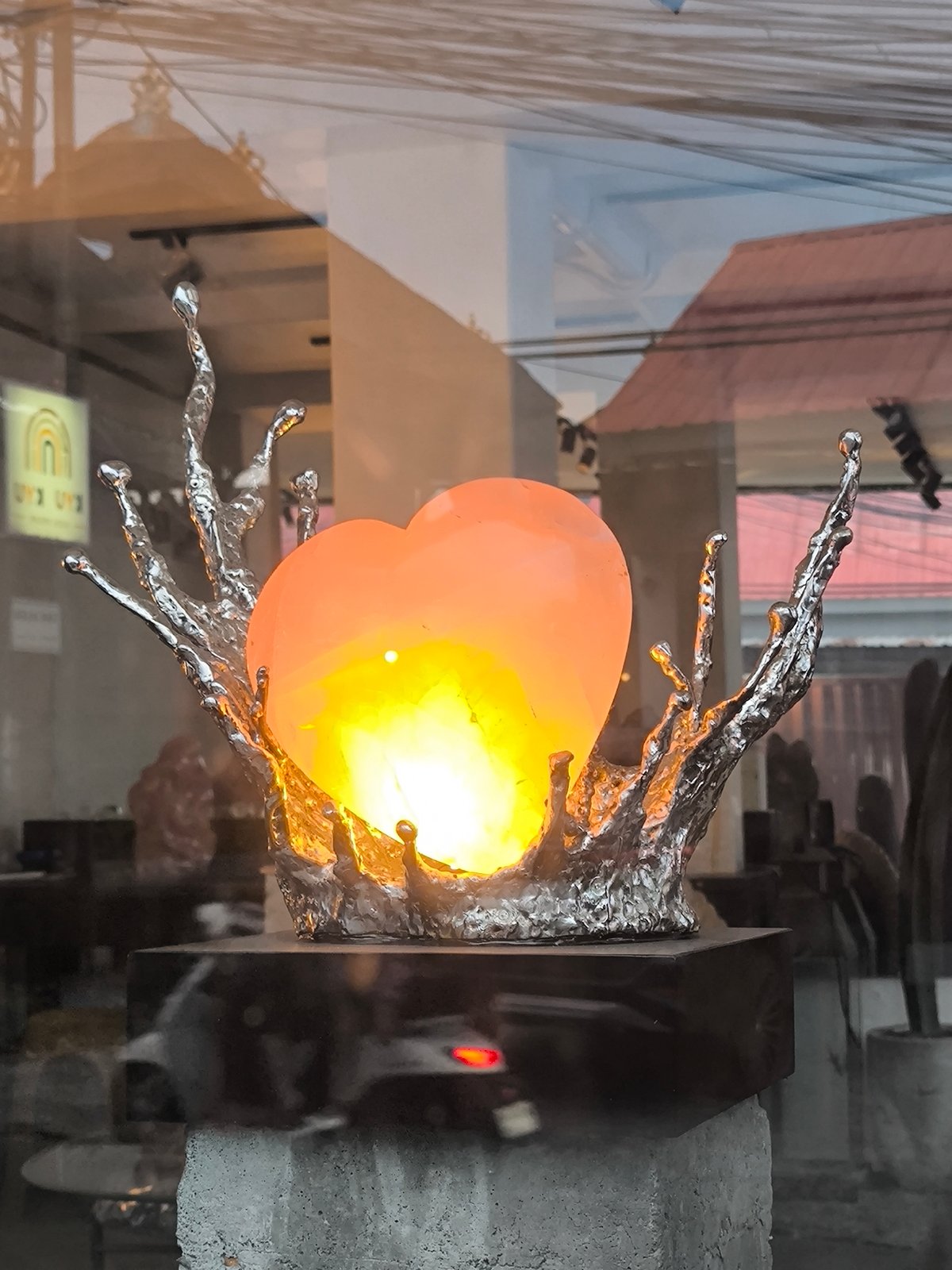 Shopper documents decorative displays in North Kuta retail store