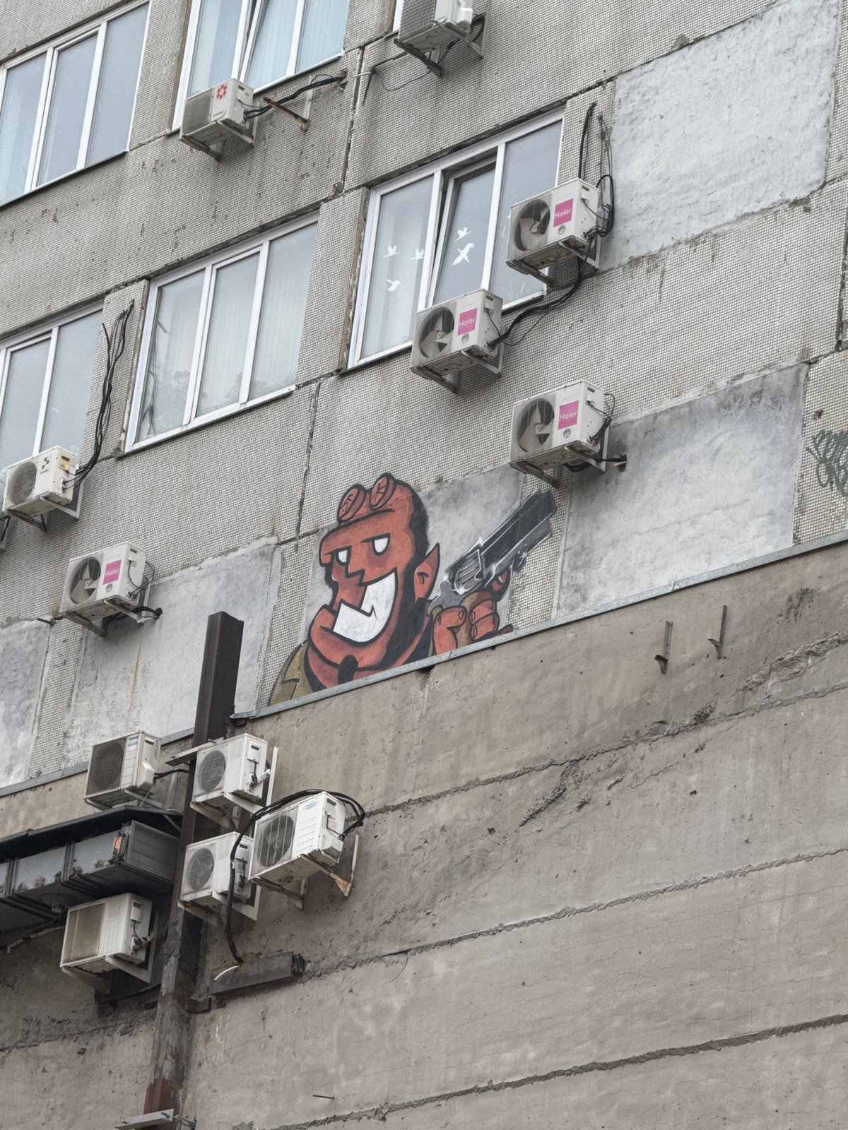 Building facade with gray tile mosaic documented in Krasnoyarsk