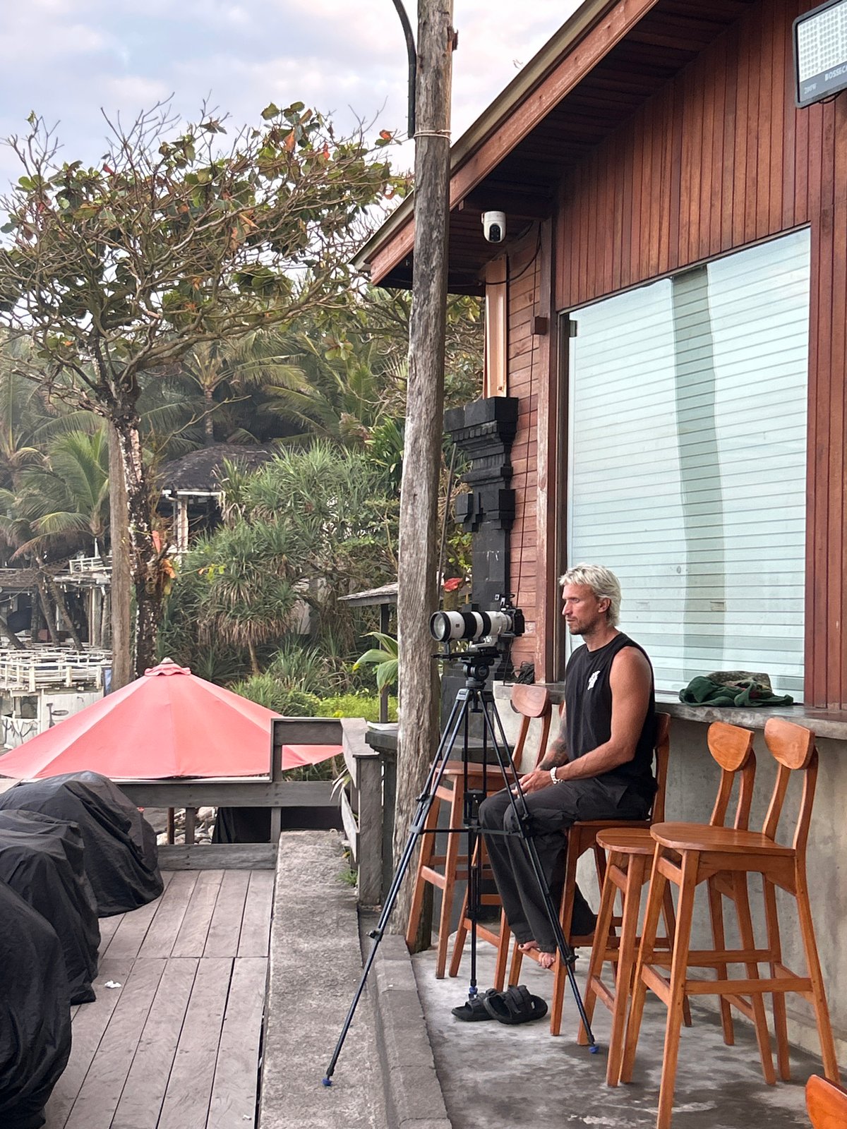 Surfers, offerings, and ocean views at North Kuta beach