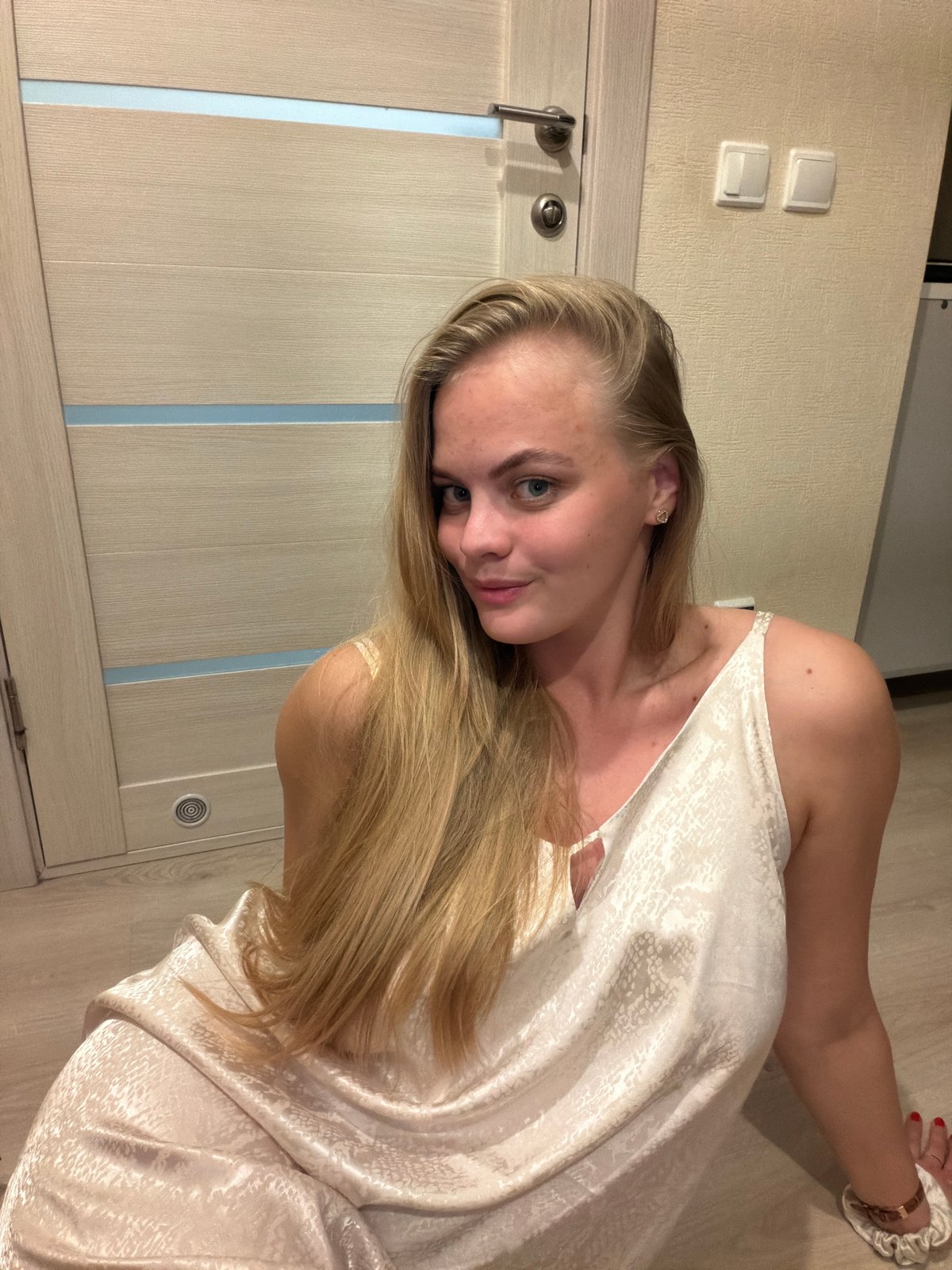Woman conducts indoor photo session in Izhevsk apartment