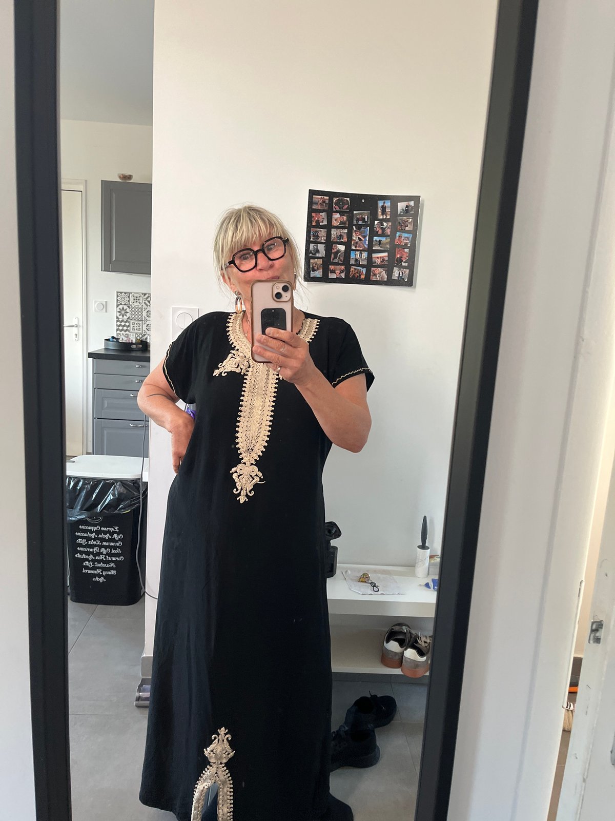 Woman takes mirror selfie in embroidered dress in Chambœuf
